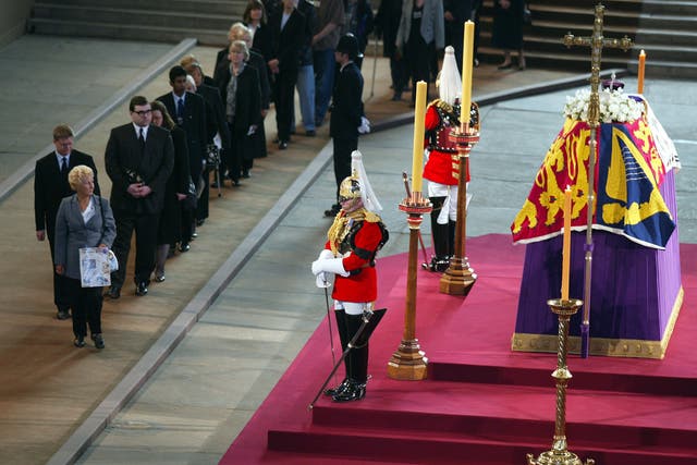 Mourners queue to file past the coffin of the Queen Mother (Phil Noble/PA)