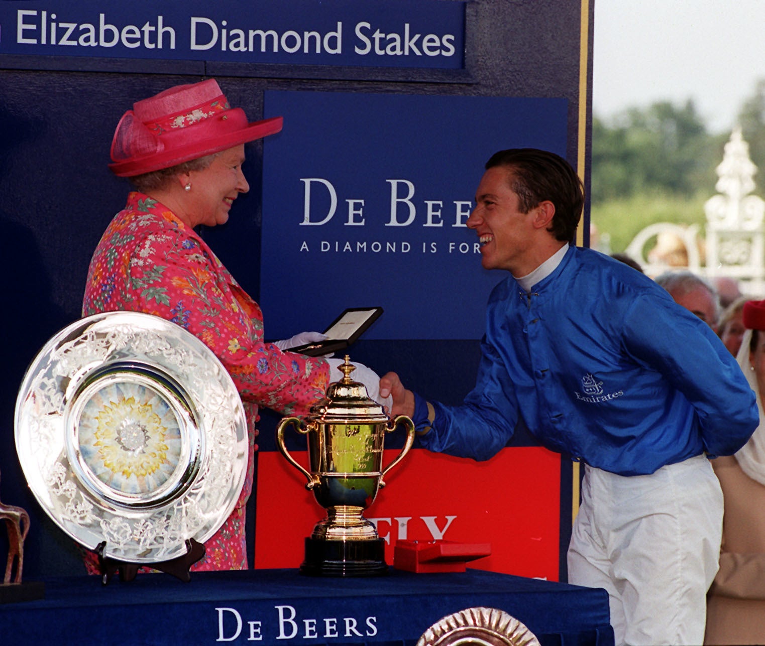 The Queen congratulating Frankie Dettori after he won the 1999 King George VI & Queen Elizabeth Diamond Stakes horserace riding Daylami, at Ascot