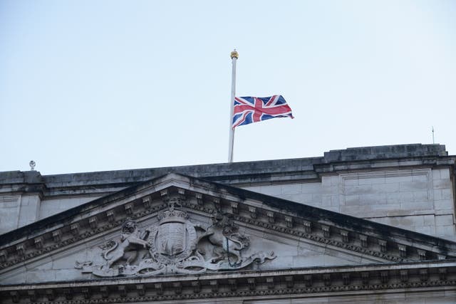 The Union Flag above Buckingham Palace in central London is flown at half mast following the announcement of the death of Queen (Yui Mok/PA)
