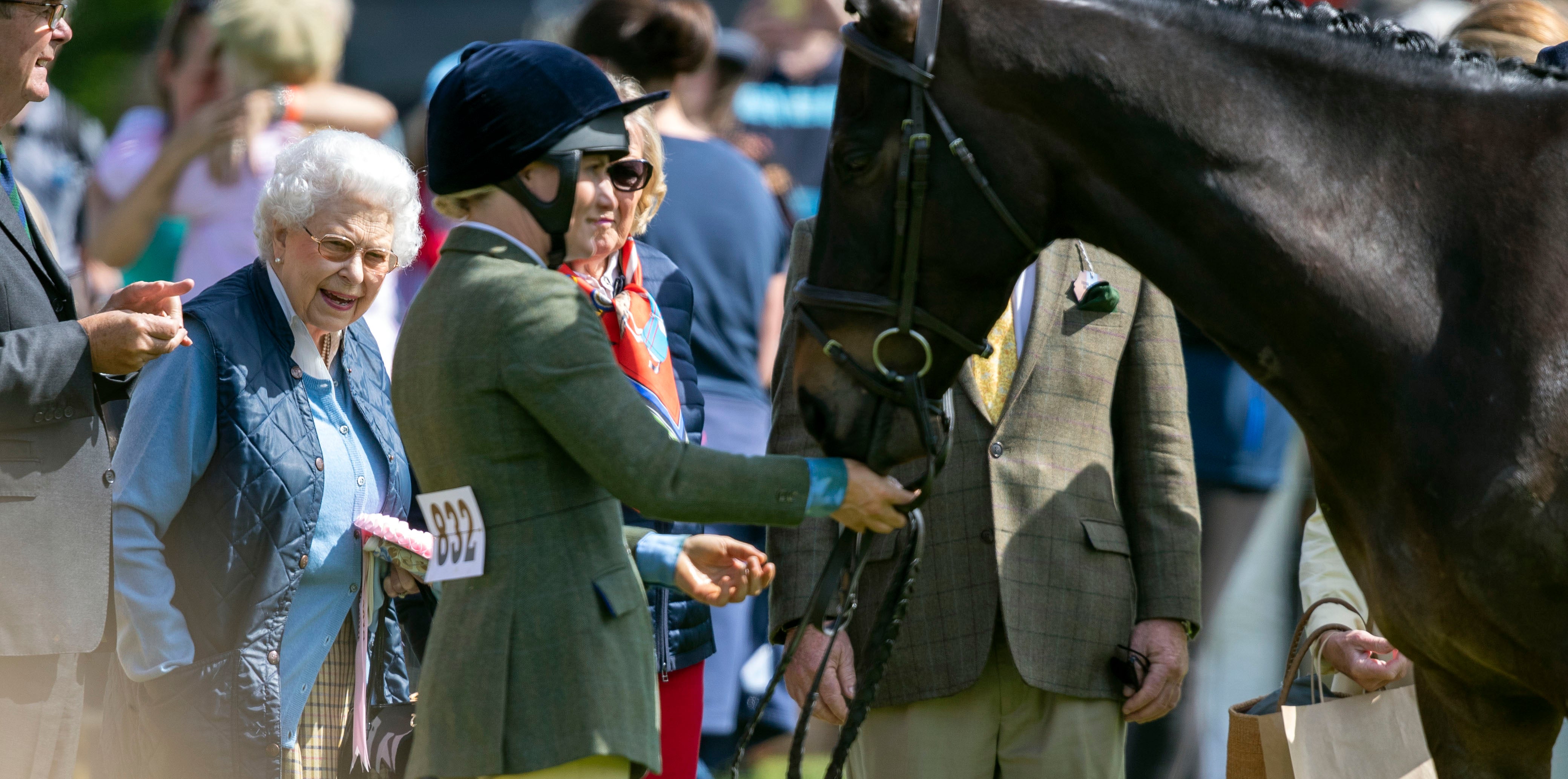 Queen Elizabeth II meets one of her horses during day one of the Royal Windsor Horse Show at Windsor Castle in 2018 (Steve Parsons/PA)