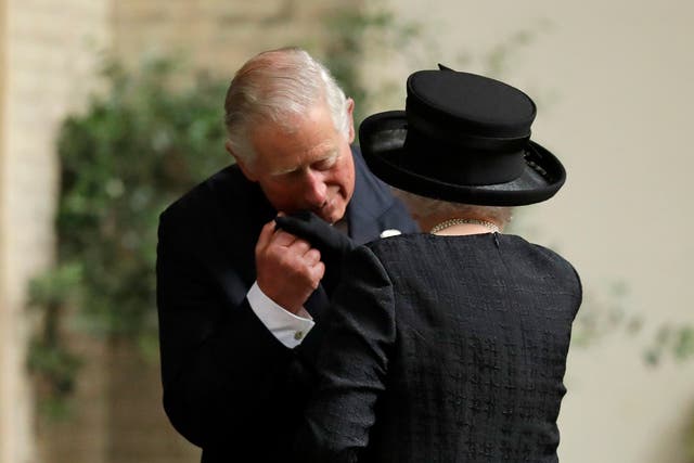 The Prince of Wales greets his mother, the Queen, at the funeral of Countess Mountbatten of Burma (Matt Dunham/PA)