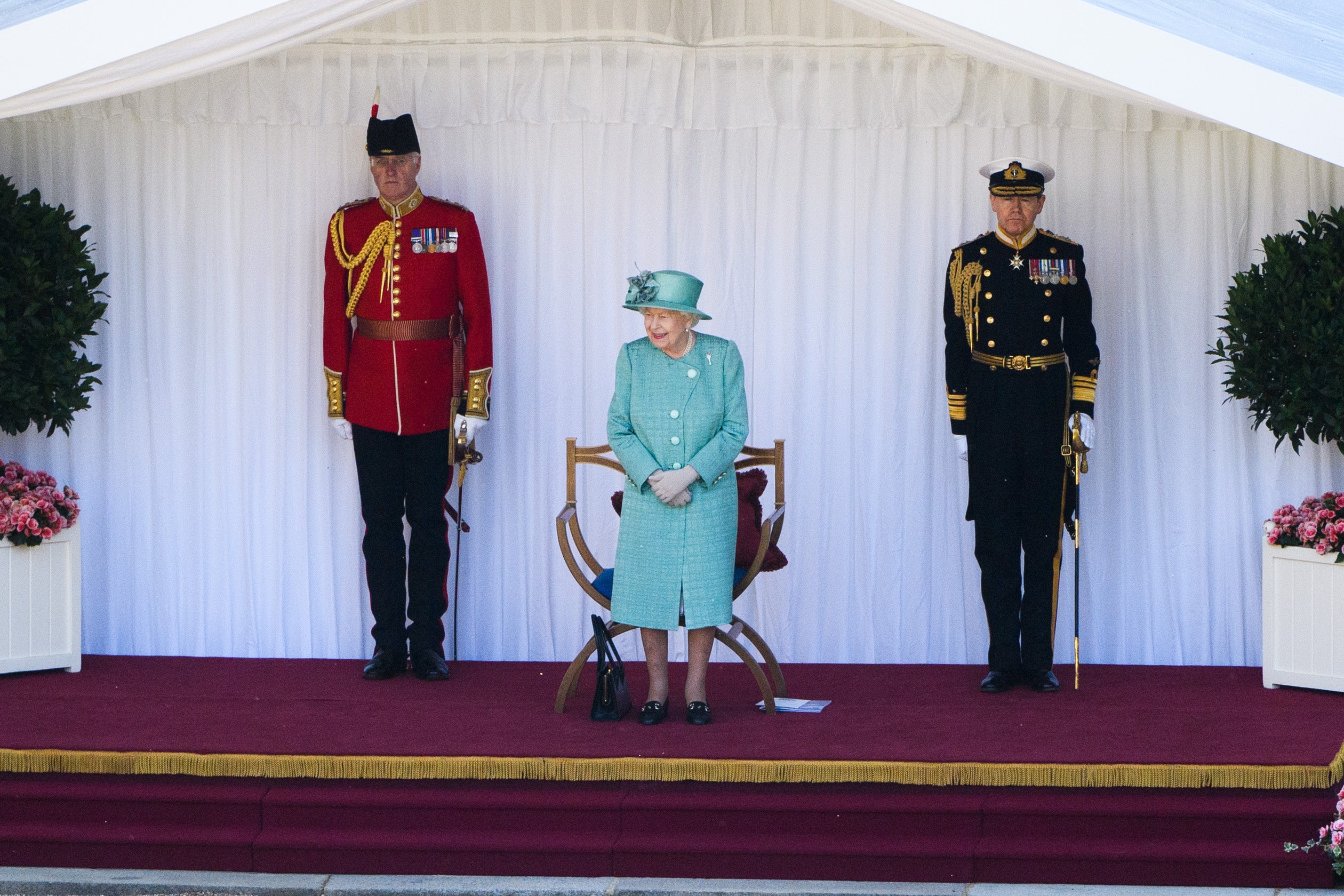 Sir Tony Johnstone-Burt (right) with the Queen (Joanne Davidson/PA)