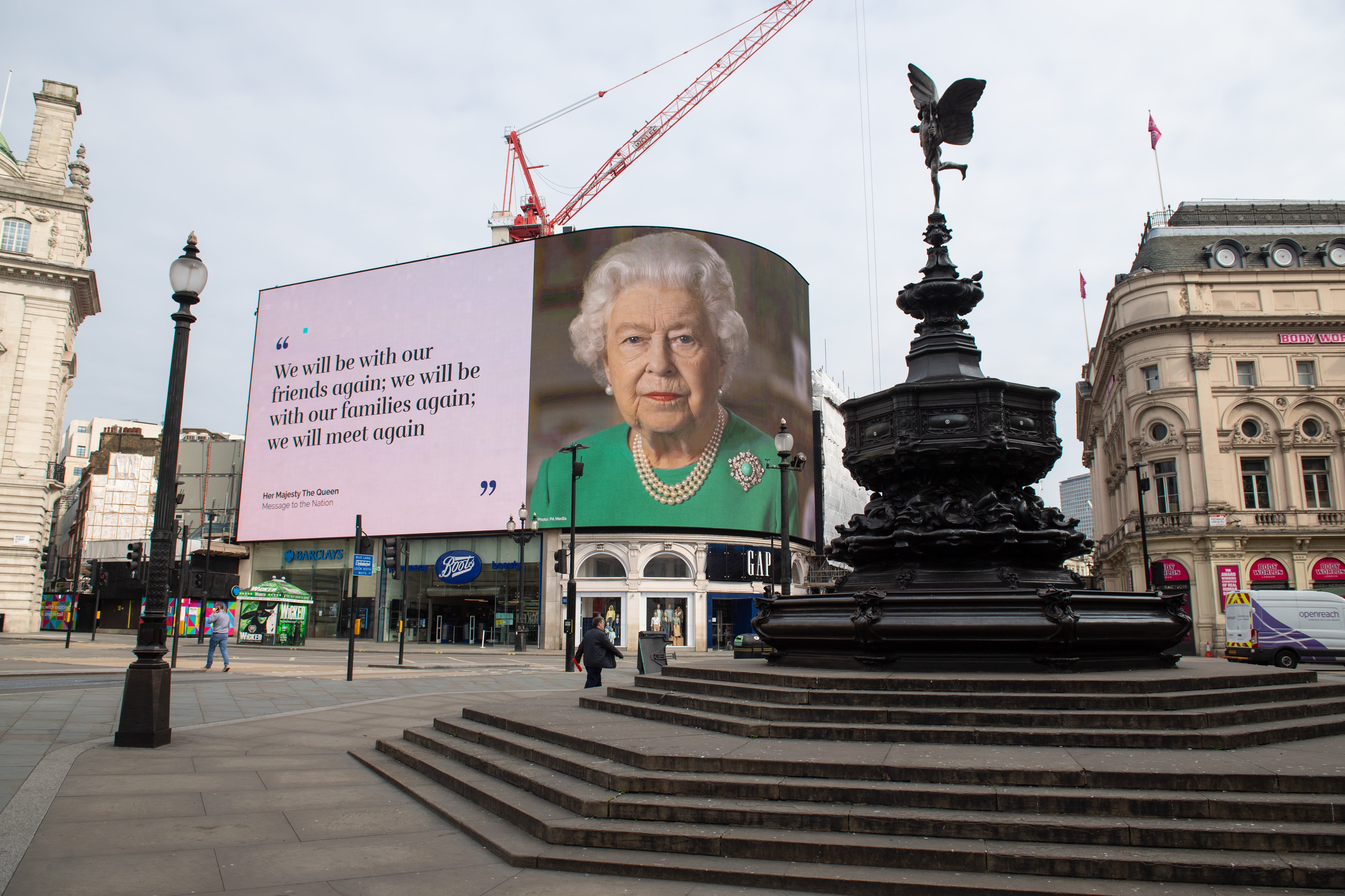 Words from the Queen’s televised address during the coronavirus pandemic up in lights at London’s Piccadilly Circus (Dominic Lipinski/PA)