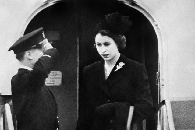 Dressed in black, Queen Elizabeth II sets foot on British soil for the first time since her accession as she lands at London Airport following the death of her father King George VI (PA)
