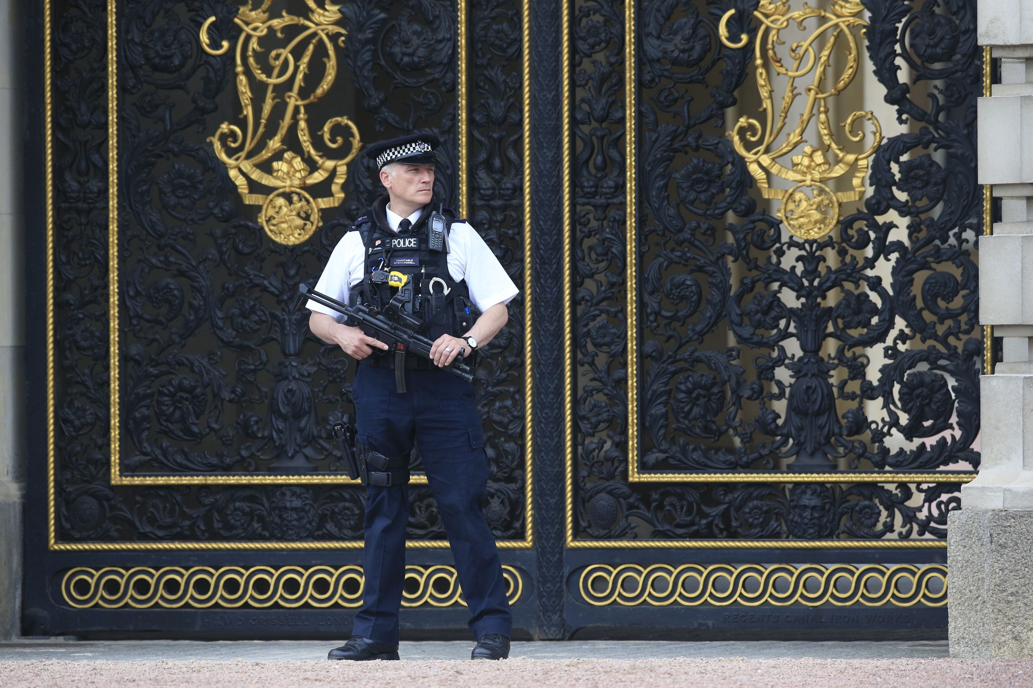 An armed police officer in the forecourt of Buckingham Palace (Jonathan Brady/PA)