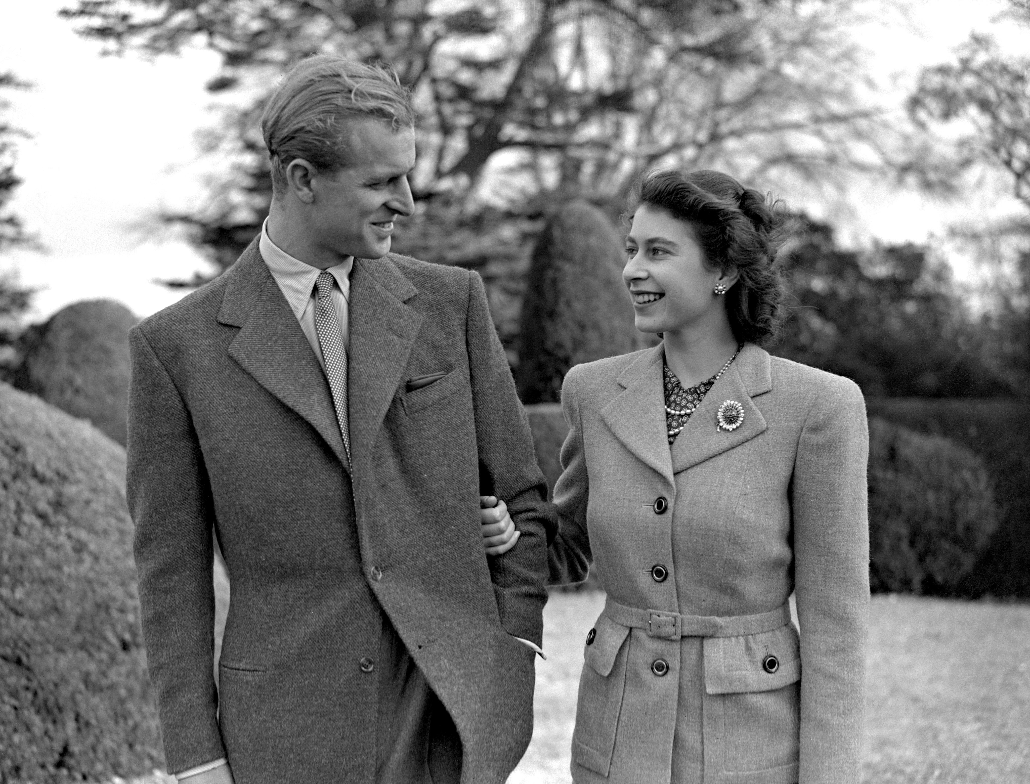 Princess Elizabeth enjoys a stroll with new husband the Duke of Edinburgh in their first public appearance since their wedding (PA)