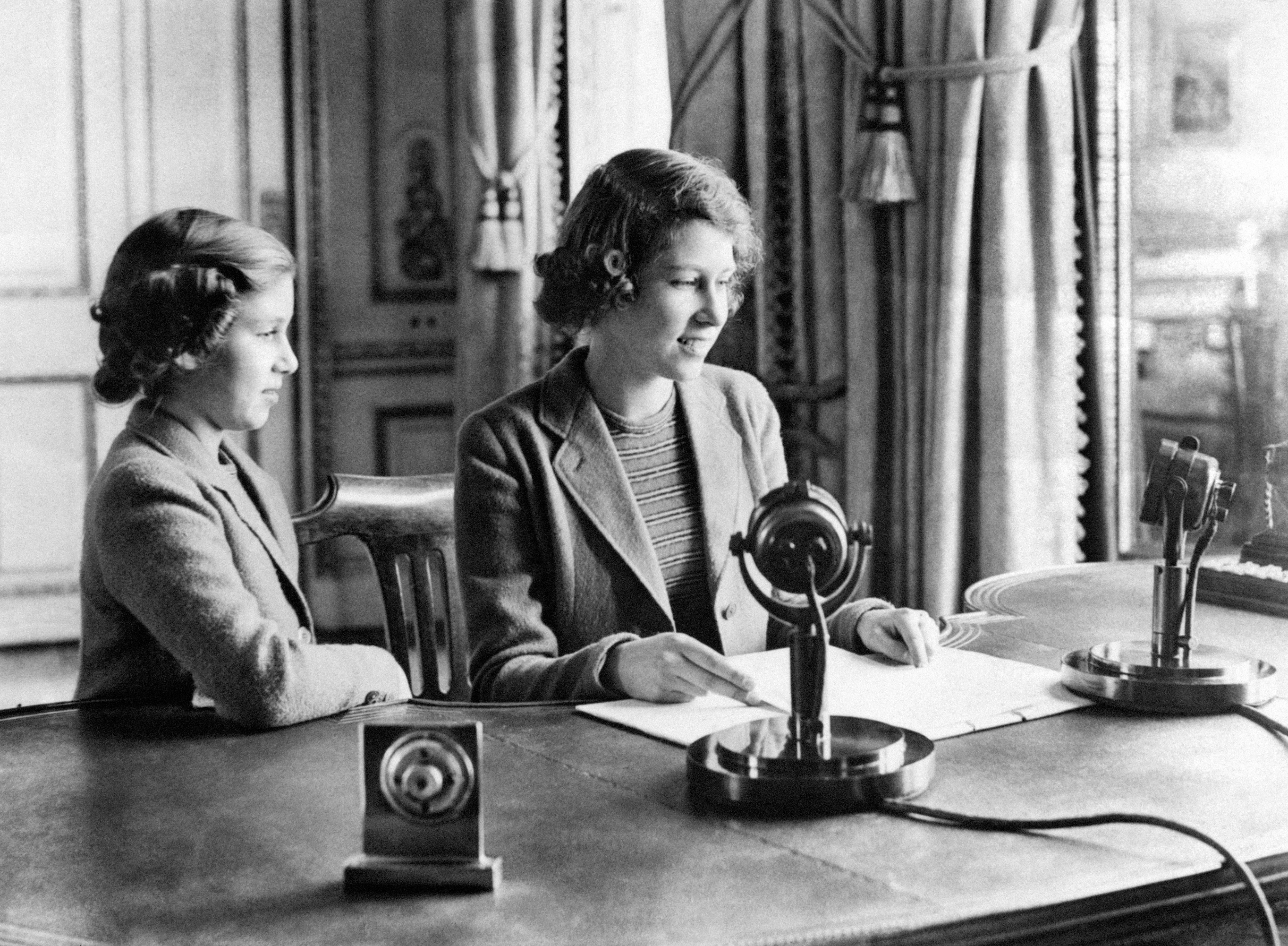 A wartime picture of Princess Elizabeth (right) and Princess Margaret after they broadcast on “Children’s Hour” from Buckingham Palace (PA)