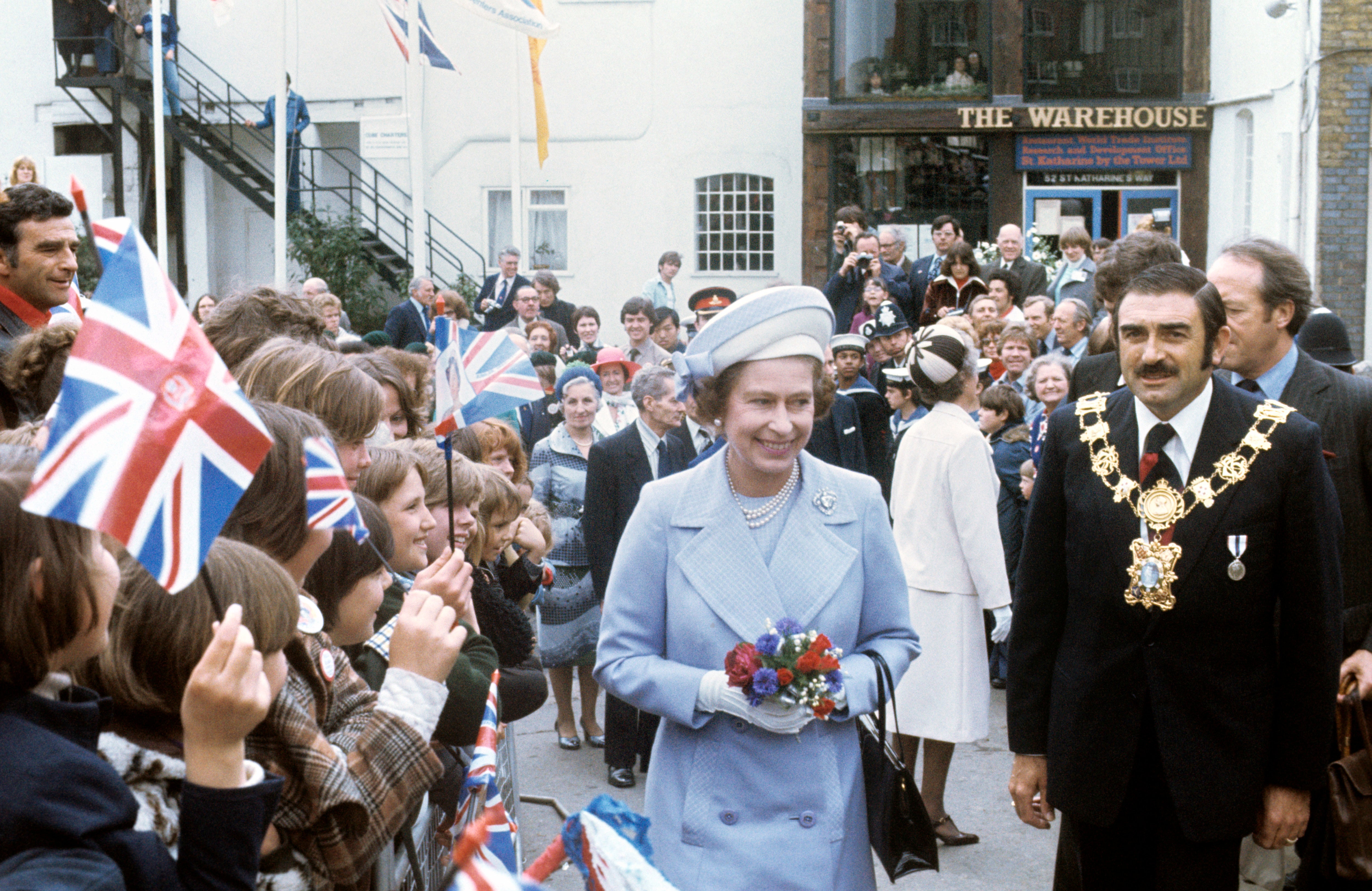 The Queen meets an enthusiastic crowd at St Katherine’s Dock near the Tower of London, one of the stops on her Silver Jubilee river progress (PA)