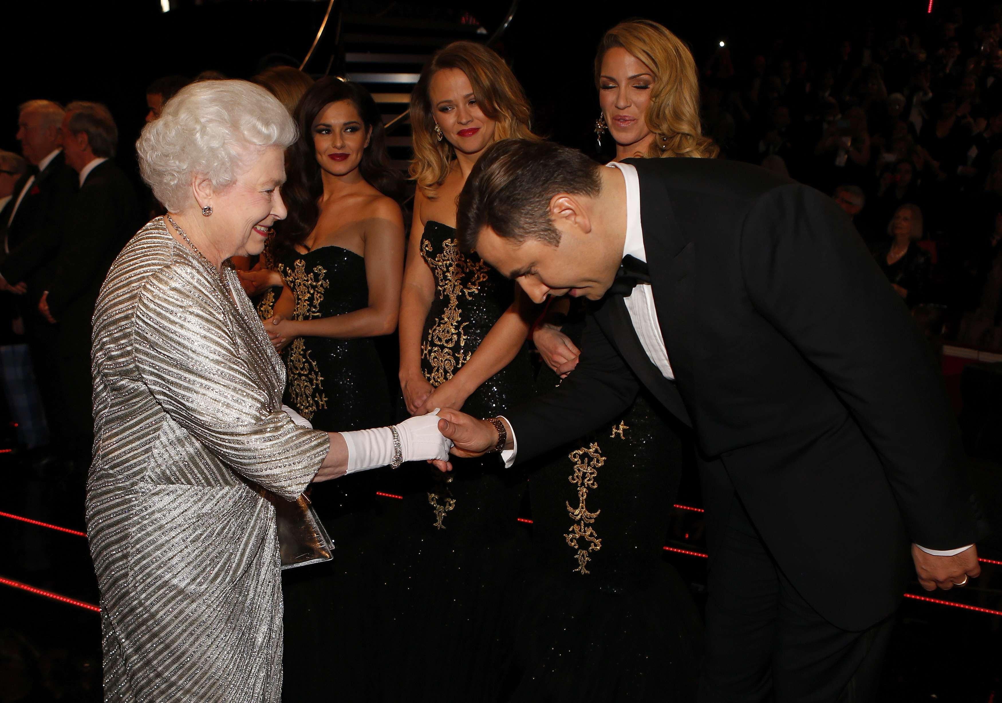 Queen Elizabeth II greets comedian David Walliams after the Royal Variety Performance at the Royal Albert Hall in London (PA)