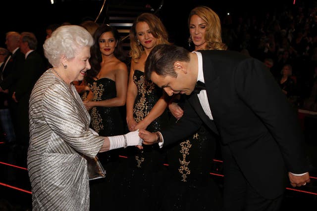 Queen Elizabeth II greets comedian David Walliams after the Royal Variety Performance at the Royal Albert Hall in London (PA)