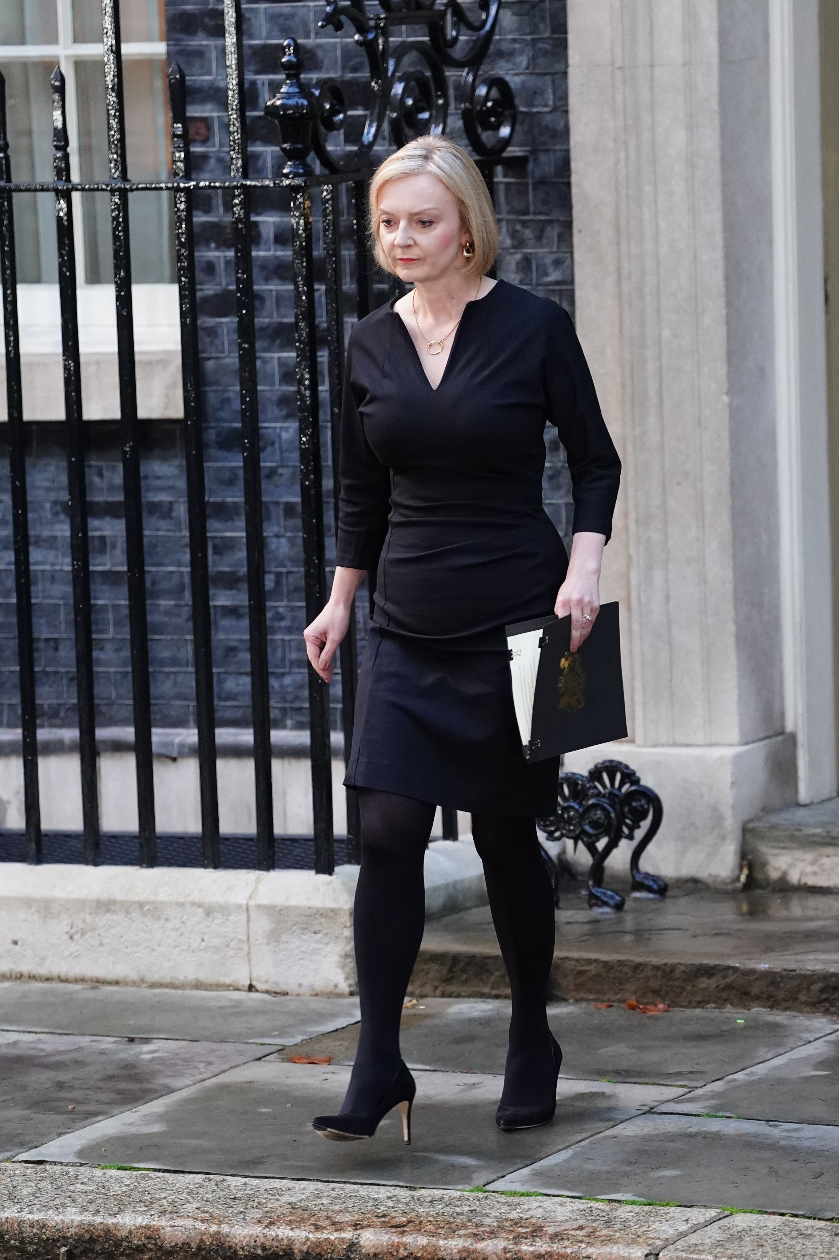 Prime Minister Liz Truss walks out of 10 Downing Street to pay tribute to the Queen (Ian West/PA)