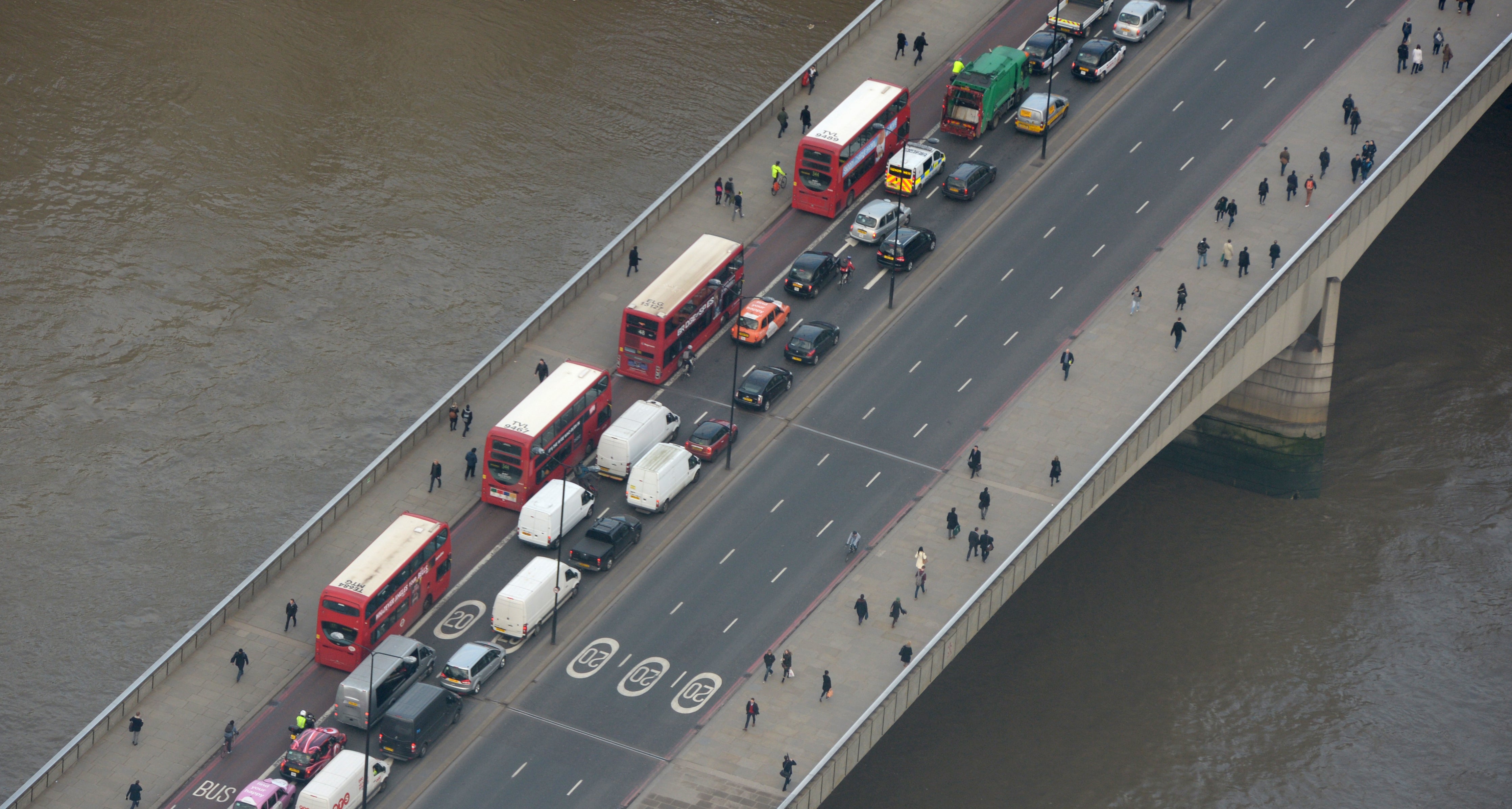 Buses and commuters drive along London Bridge (Anthony Devlin/PA)