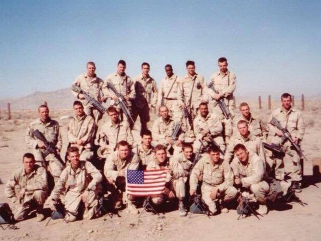 <p>Sgt Bill Bee (front row, fourth from left) is seen with his platoon during the War on Terror</p>