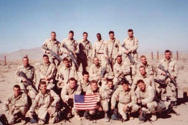 <p>Sgt Bill Bee (front row, fourth from left) is seen with his platoon during the War on Terror</p>