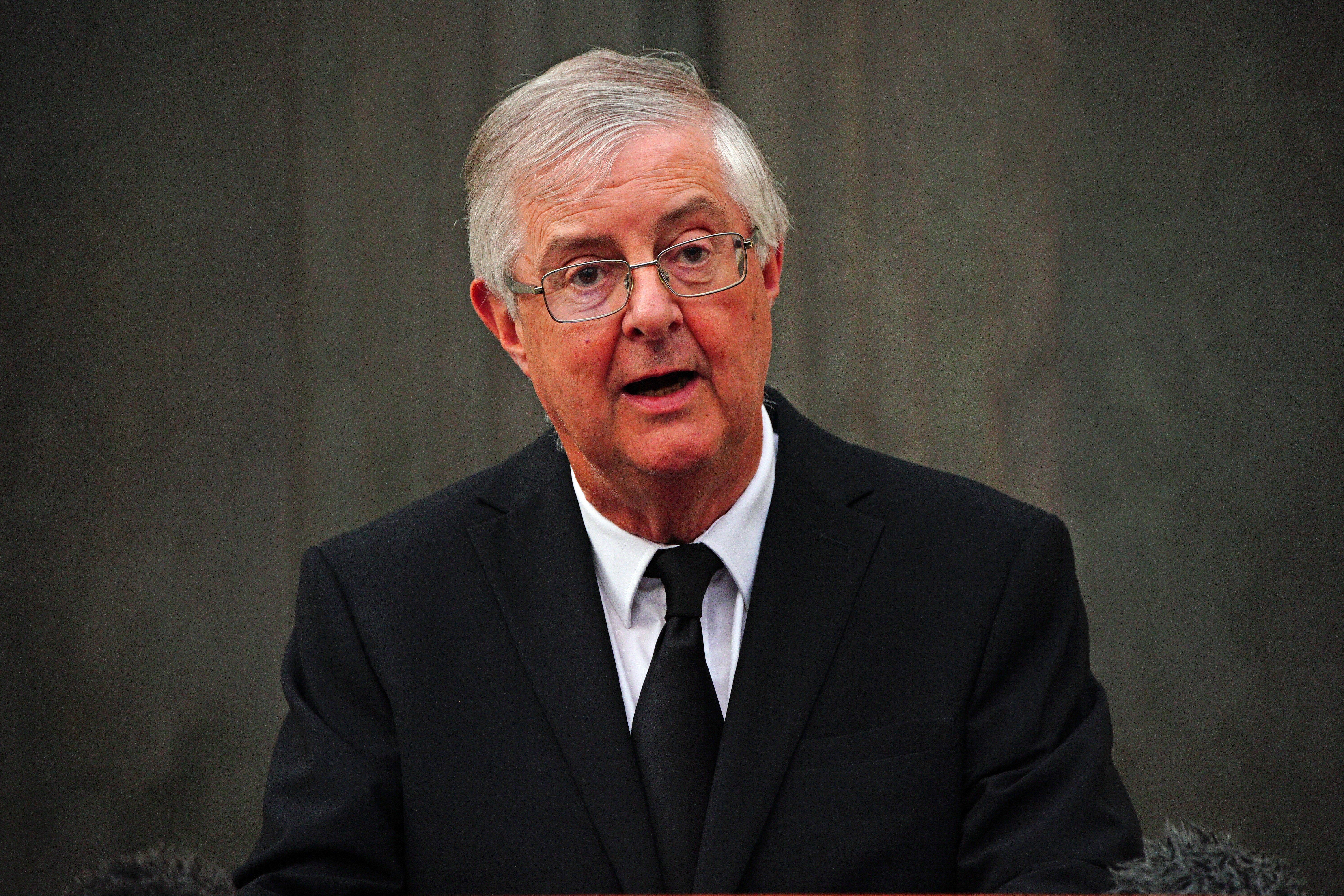 First Minister of Wales Mark Drakeford reads a statement outside the Senedd in Cardiff Bay, Wales, following the announcement of the death of Queen Elizabeth II (Ben Birchall/PA)