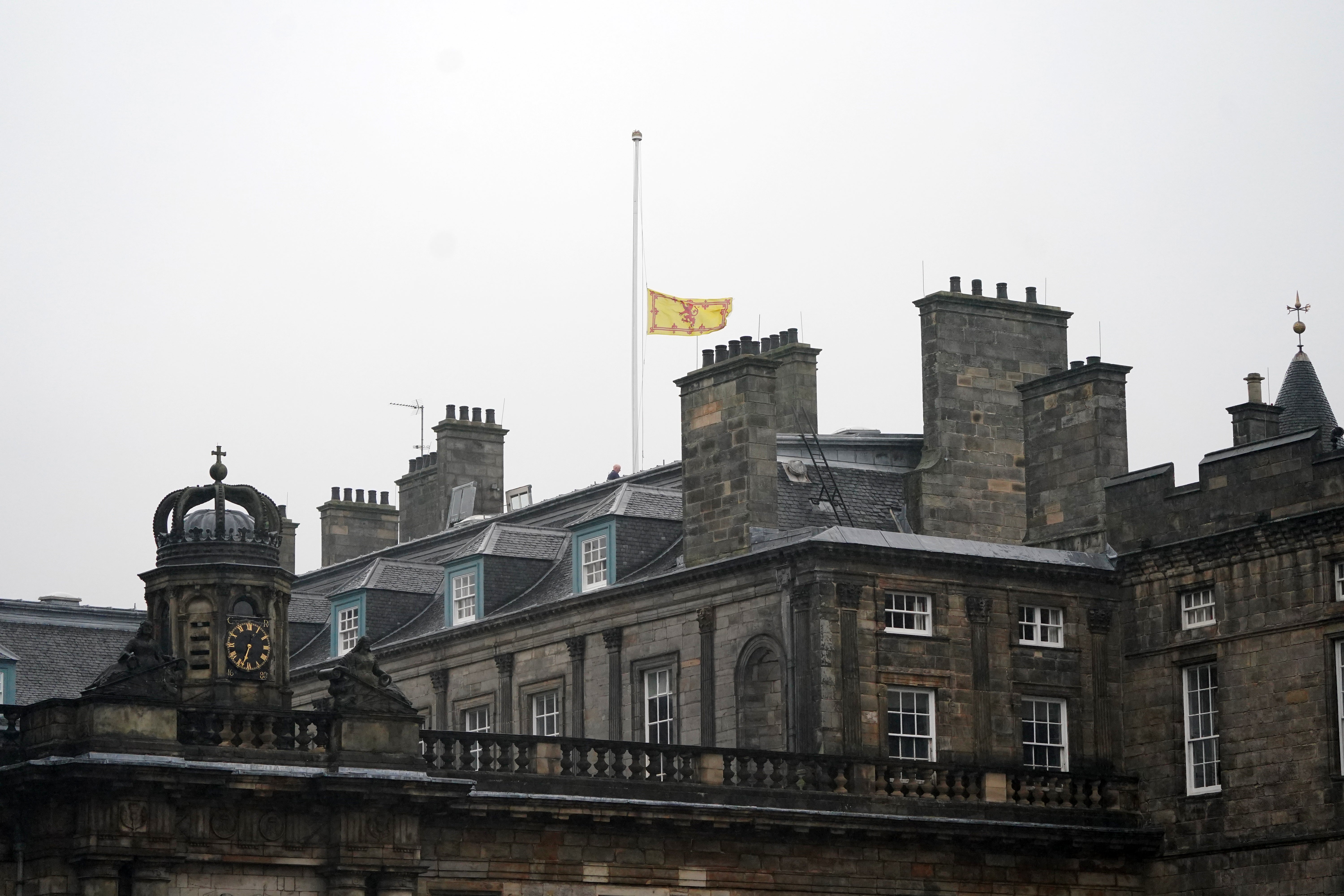 The Royal Banner of Scotland above the Palace of Holyroodhouse in Edinburgh is flown at half mast