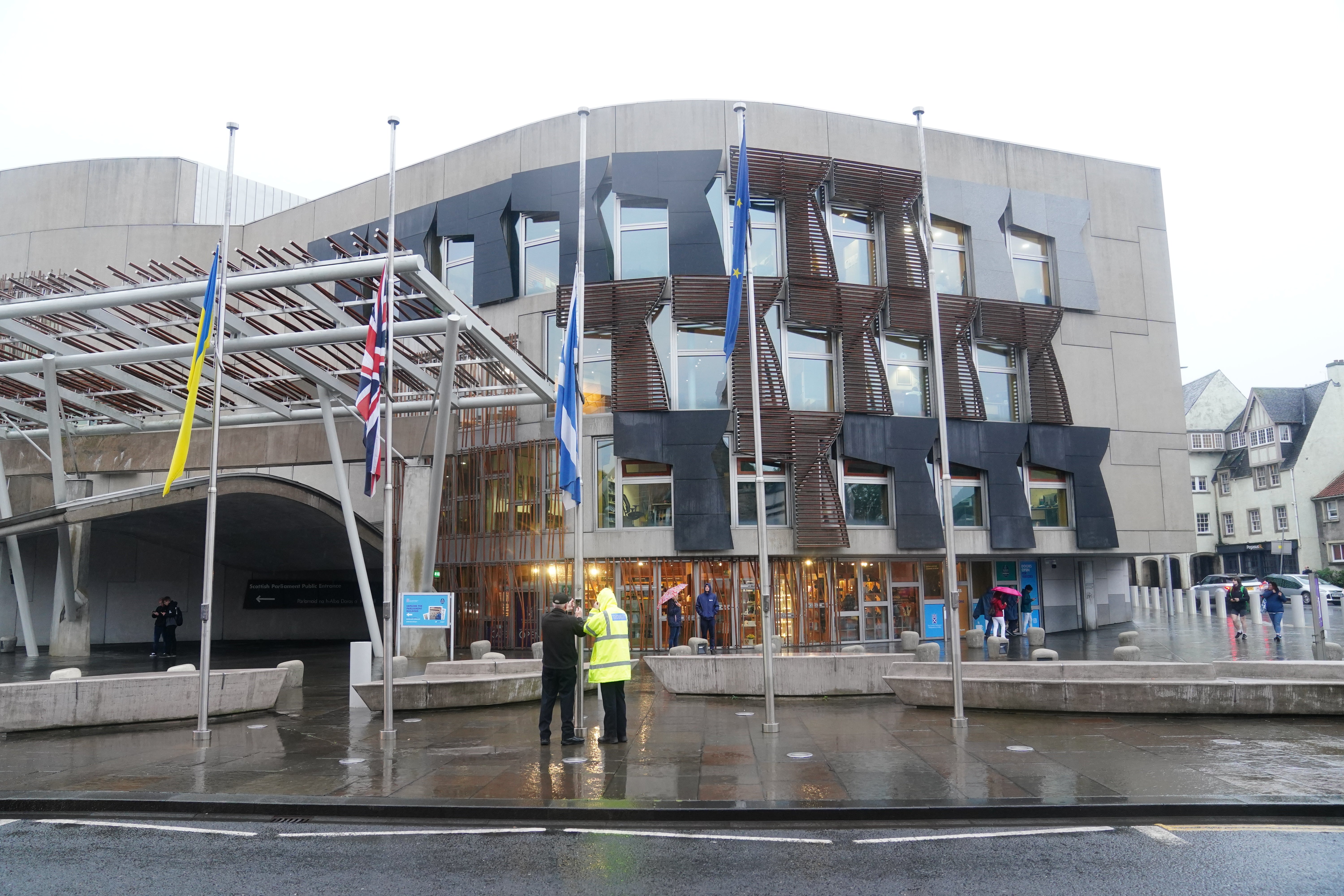 Flags are lowered to half mast outside the Scottish Parliament building at Holyrood in Edinburgh (Jane Barlow/PA)