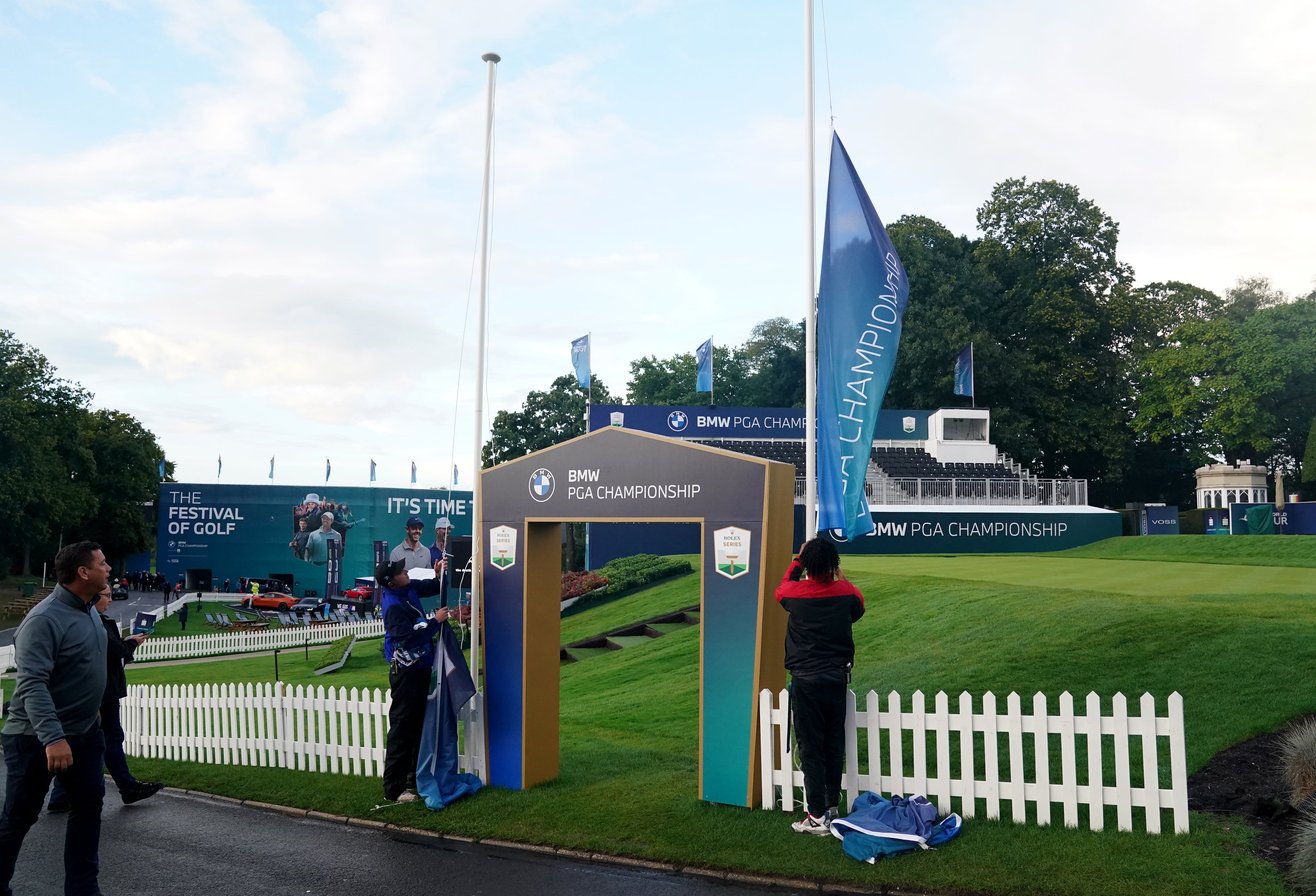 Flags are removed as a mark of respect after play was suspended during day one of the BMW PGA Championship at Wentworth Golf Club, Virginia Water (Adam Davy/PA)
