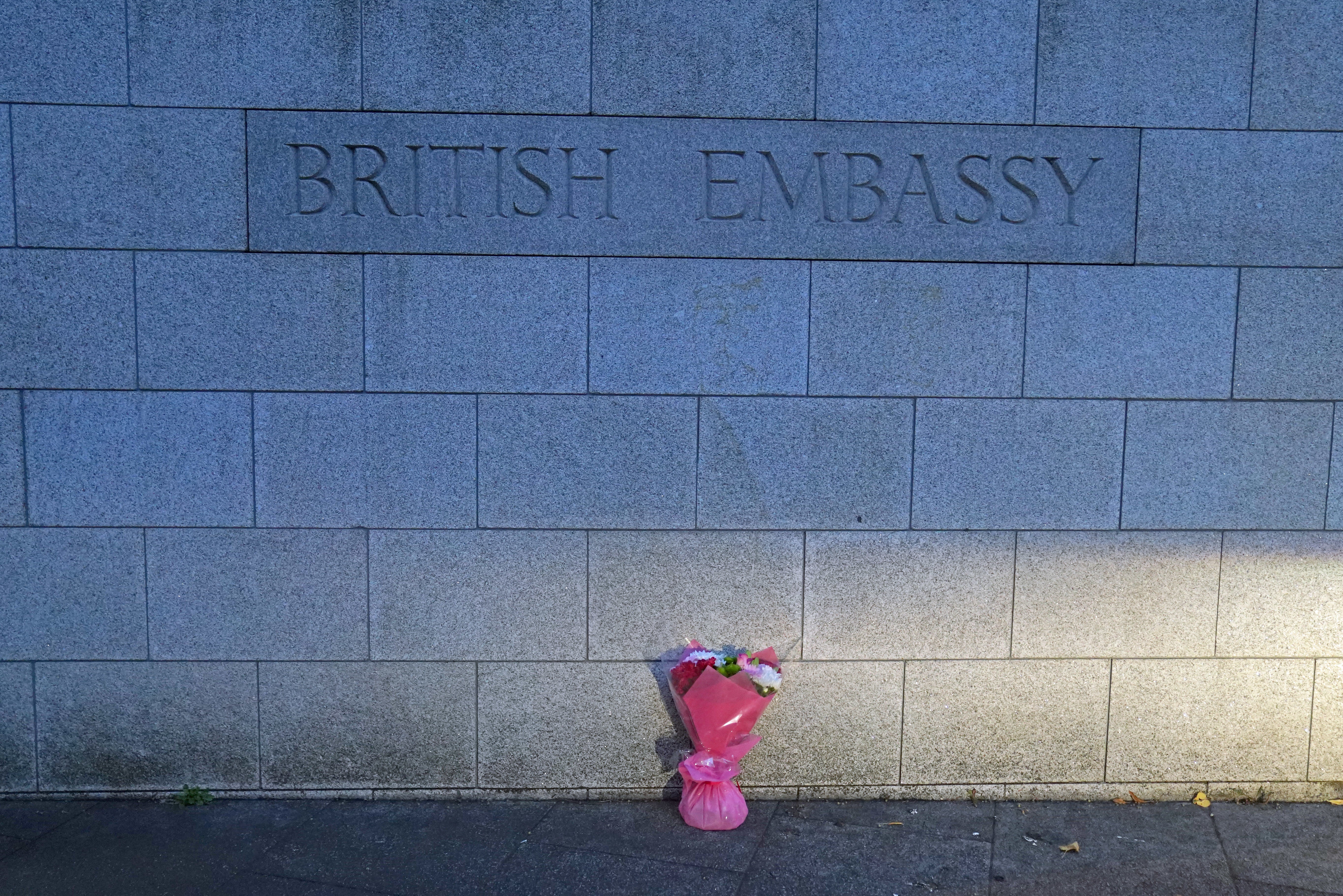 A bouquet of flowers is placed outside the British Embassy in Dublin following the announcement (Brian Lawless/PA)