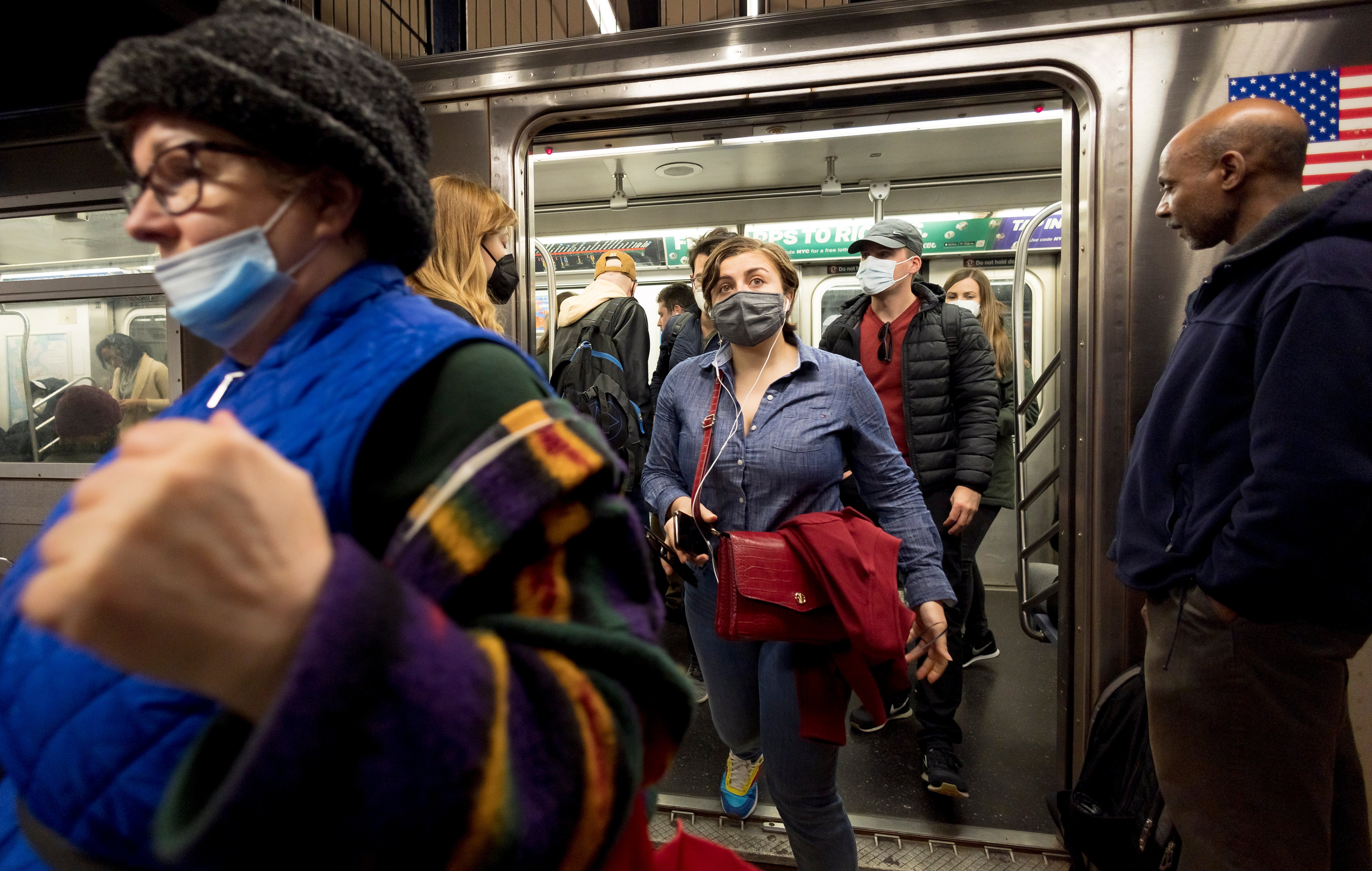 People enter and exit a New York City subway car in New York, New York, USA, 21 April 2022