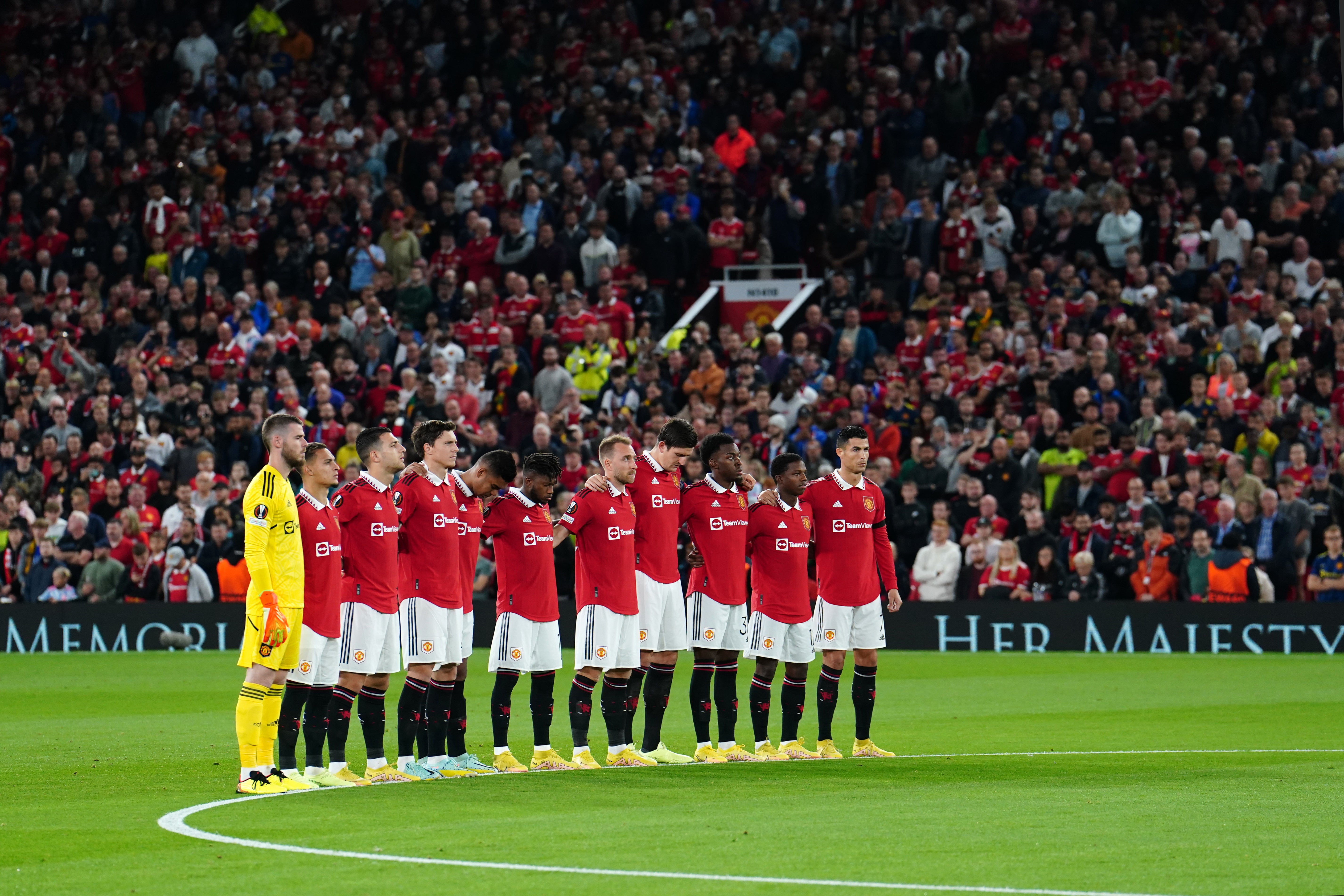 Manchester United take part in a minute’s silence at Old Trafford on Thursday