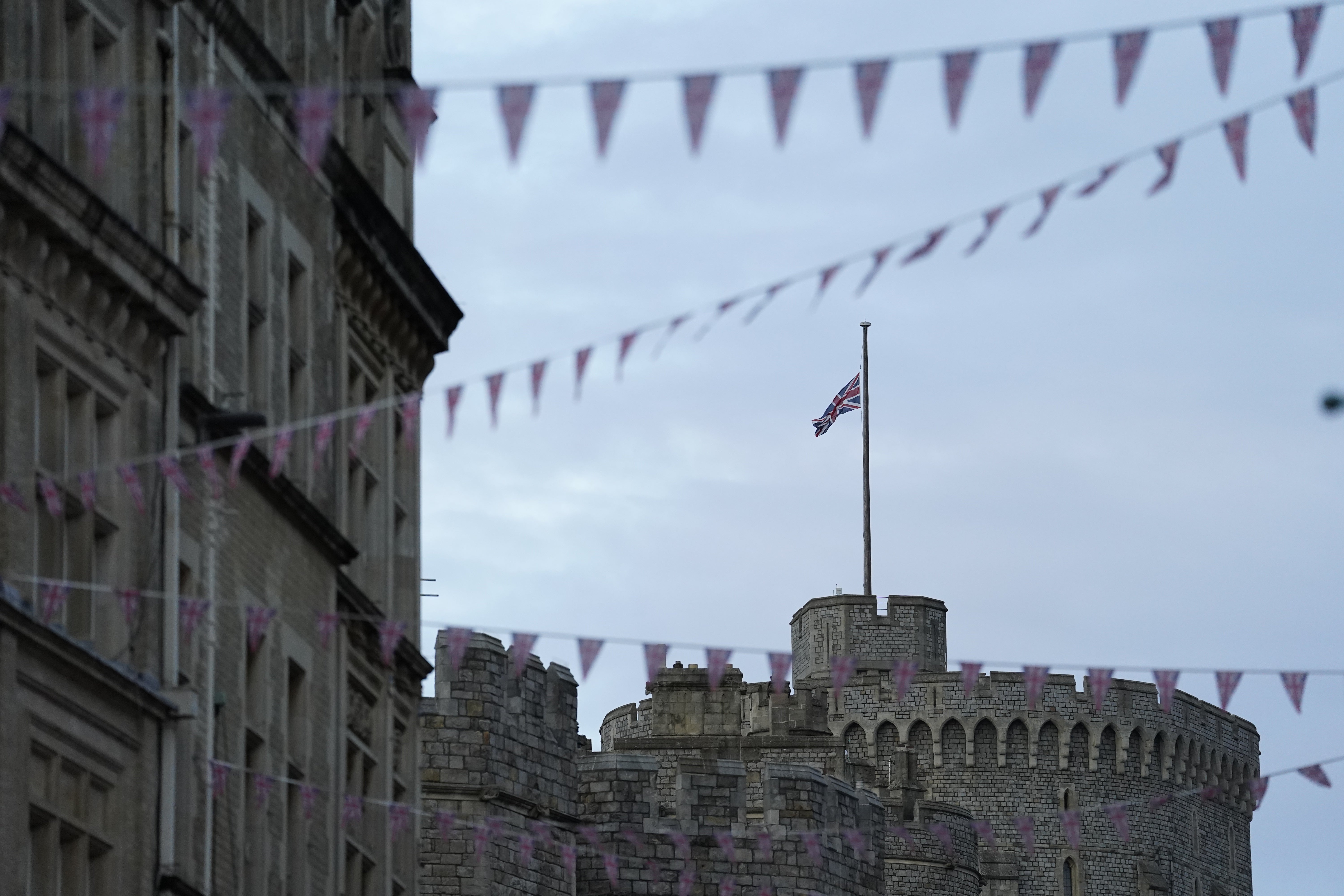 The Union Flag flies at half mast over Windsor Castle in Berkshire following the announcement of the death of Queen Elizabeth II (Andrew Matthews/PA)