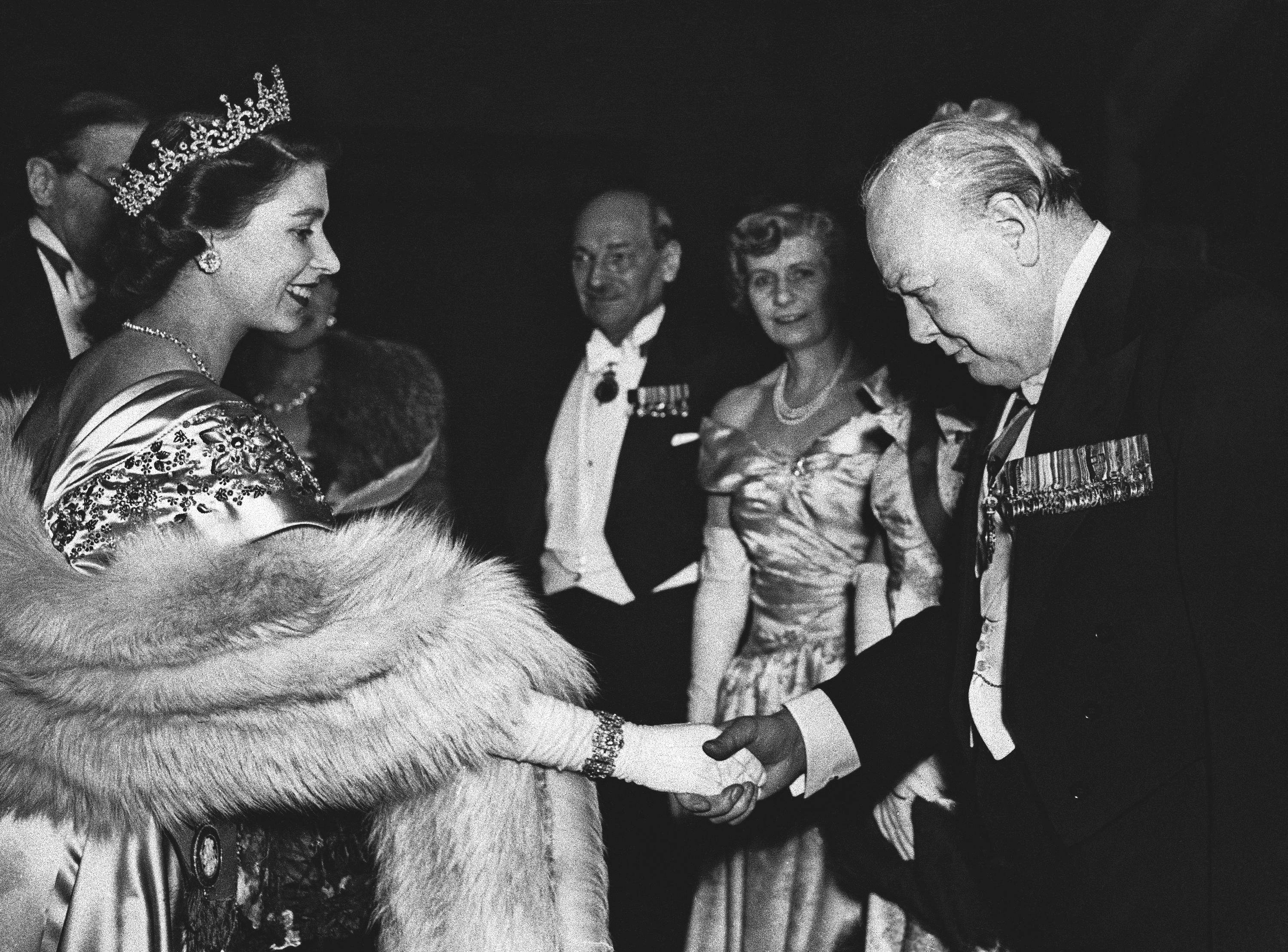 Queen Elizabeth II greets Winston Churchill in 1950, with prime minister Clement Attlee and his wife in the background. A year later, Churchill returned to No 10 after defeating Attlee in the second post-war general election