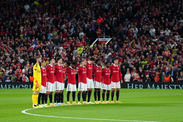 Manchester United take part in a minute’s silence (Martin Rickett/PA)