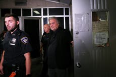 ‘You greasy grifter’: Steve Bannon heckled as he turns himself in on border wall fraud charges