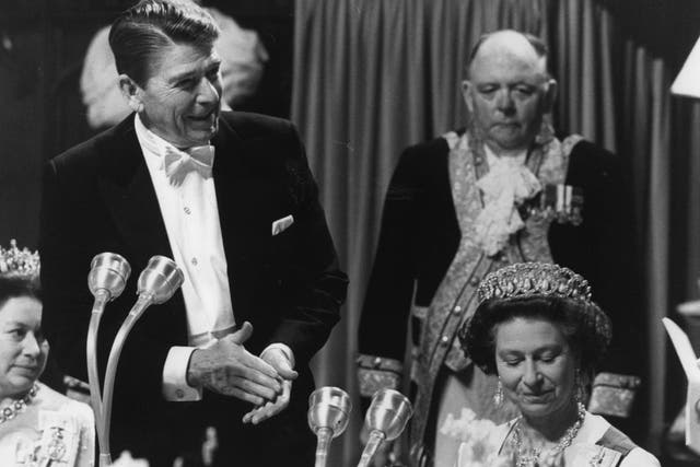 Ronald Reagan addresses the Queen at a banquet (PA)