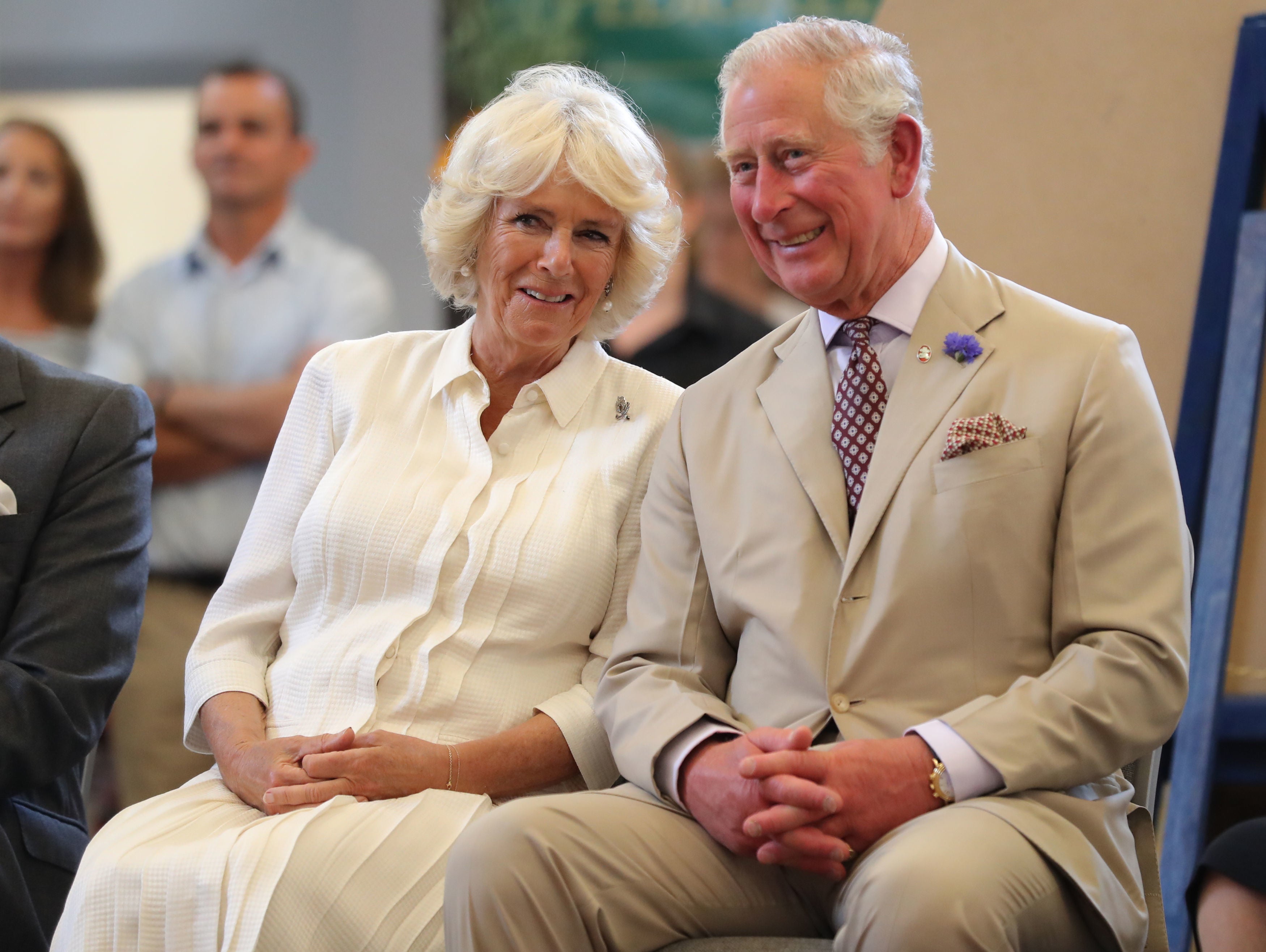 The then-Duchess of Cornwall and Charles watching a pantomime performance during the reopening of the newly renovated Strand Hall in Builth Wells, Wales (Andrew Matthews/PA)