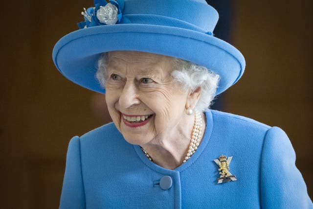 The Queen chose brightly-coloured outfits to ensure she was visible at public appearances (Jane Barlow/PA)