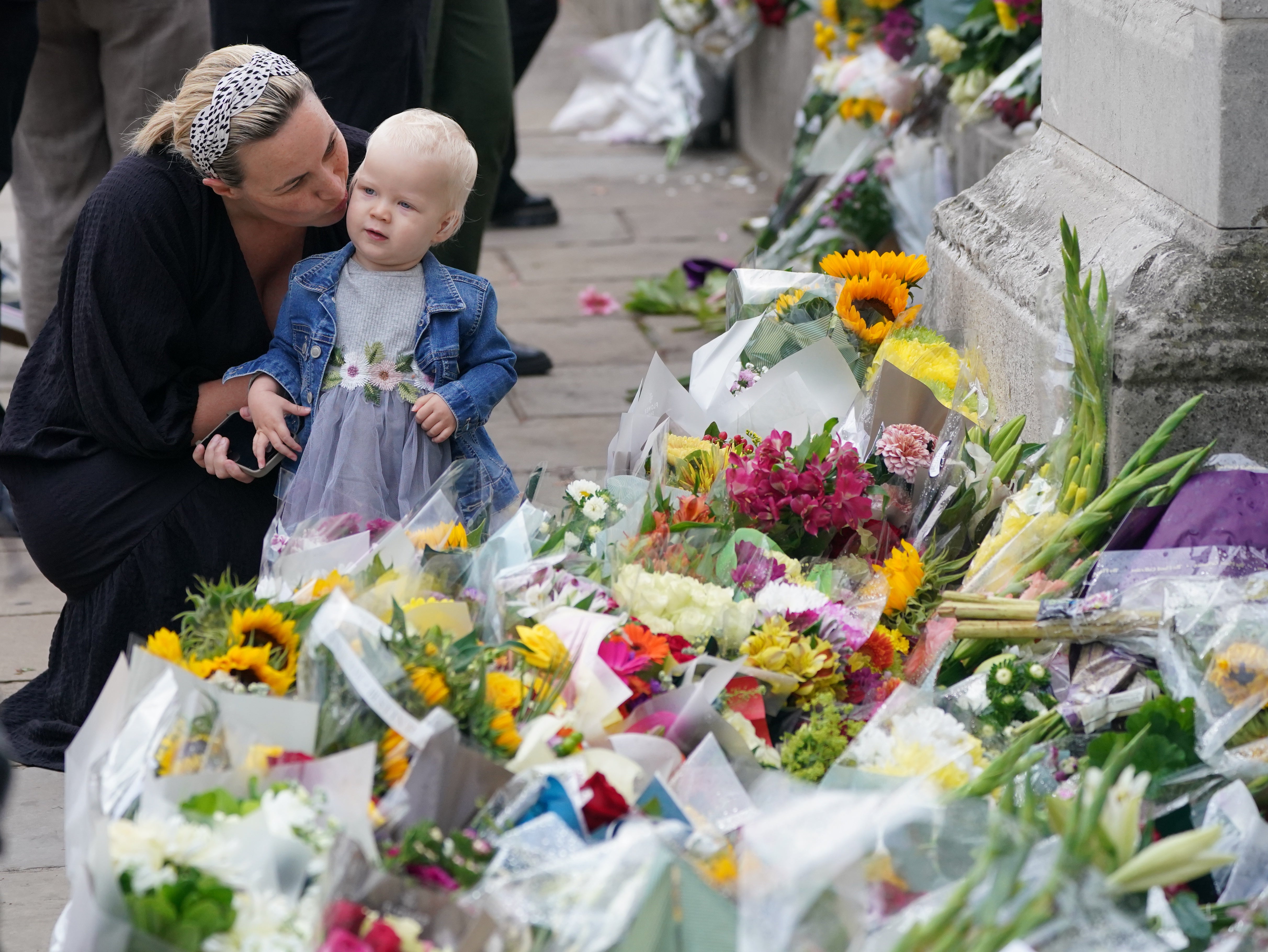 Hundreds of floral tributes have been left at the gates of Buckingham Palace (Dominic Lipinski/PA)