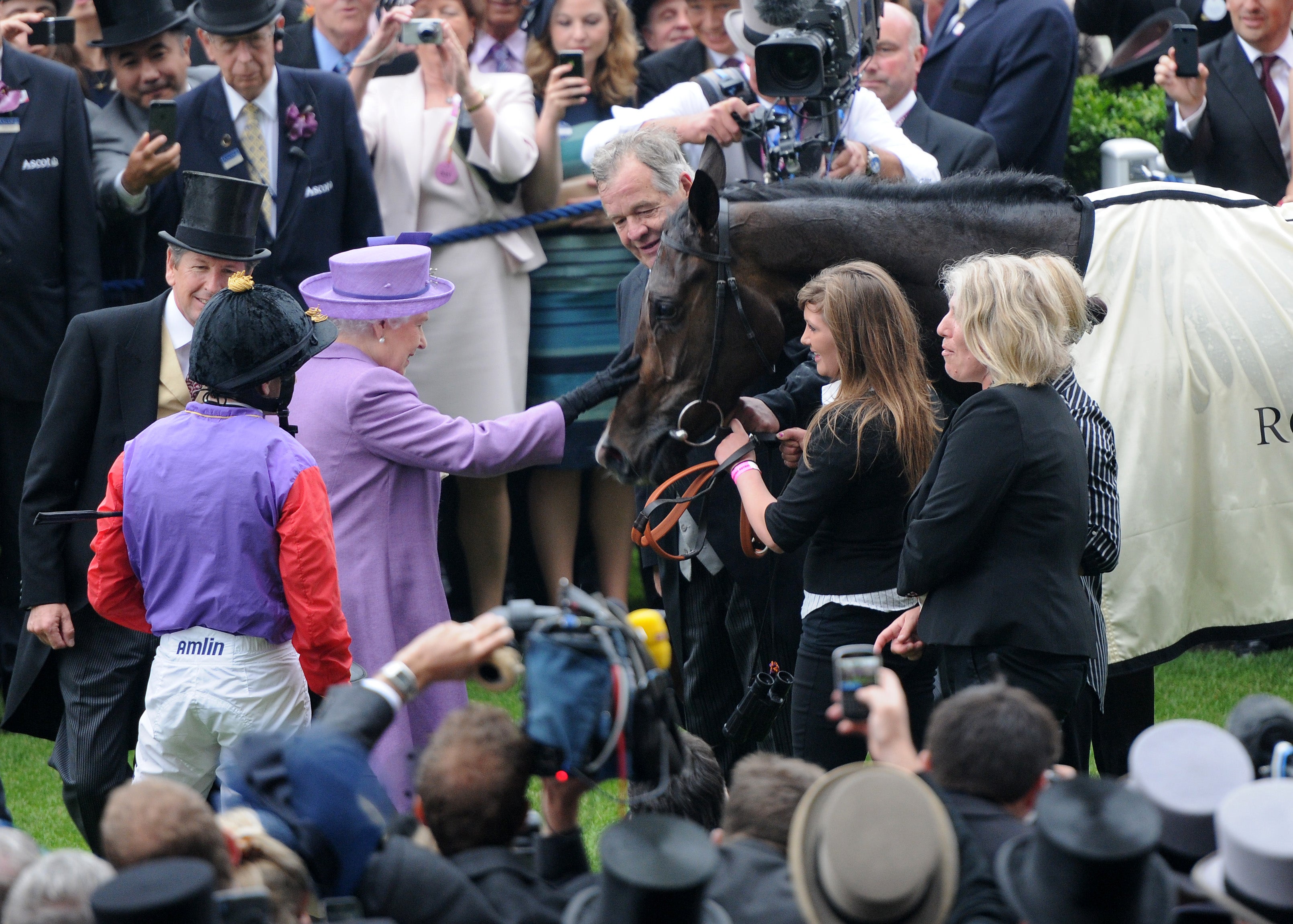 The Queen congratulates her horse, Estimate, following a Gold Cup win on Ladies’ Day at Royal Ascot in 2013