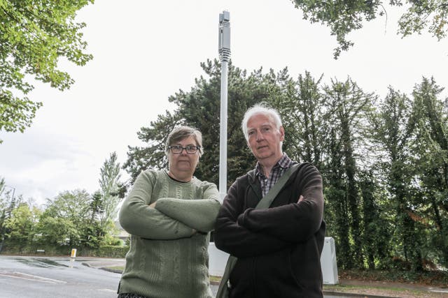 <p>Husband and wife Ray and Sheila Lillie, live yards from the mast which now towers above their home</p>