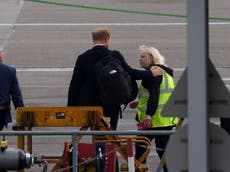 Touching moment Prince Harry comforts airport worker as he flies out from Balmoral