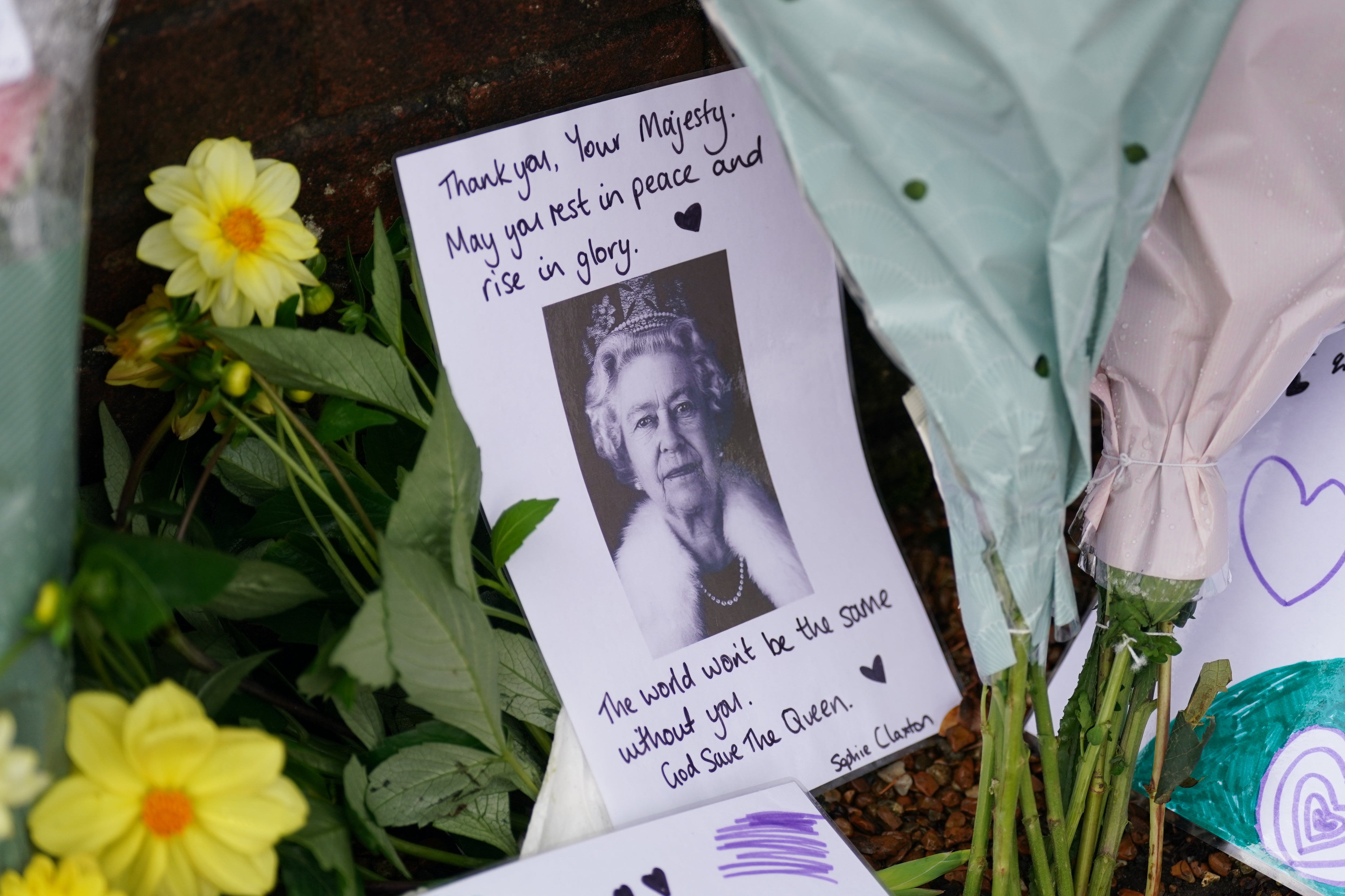 Floral tributes and messages at the Sandringham Estate in Norfolk following the death of Queen Elizabeth II (Joe Giddens/PA)