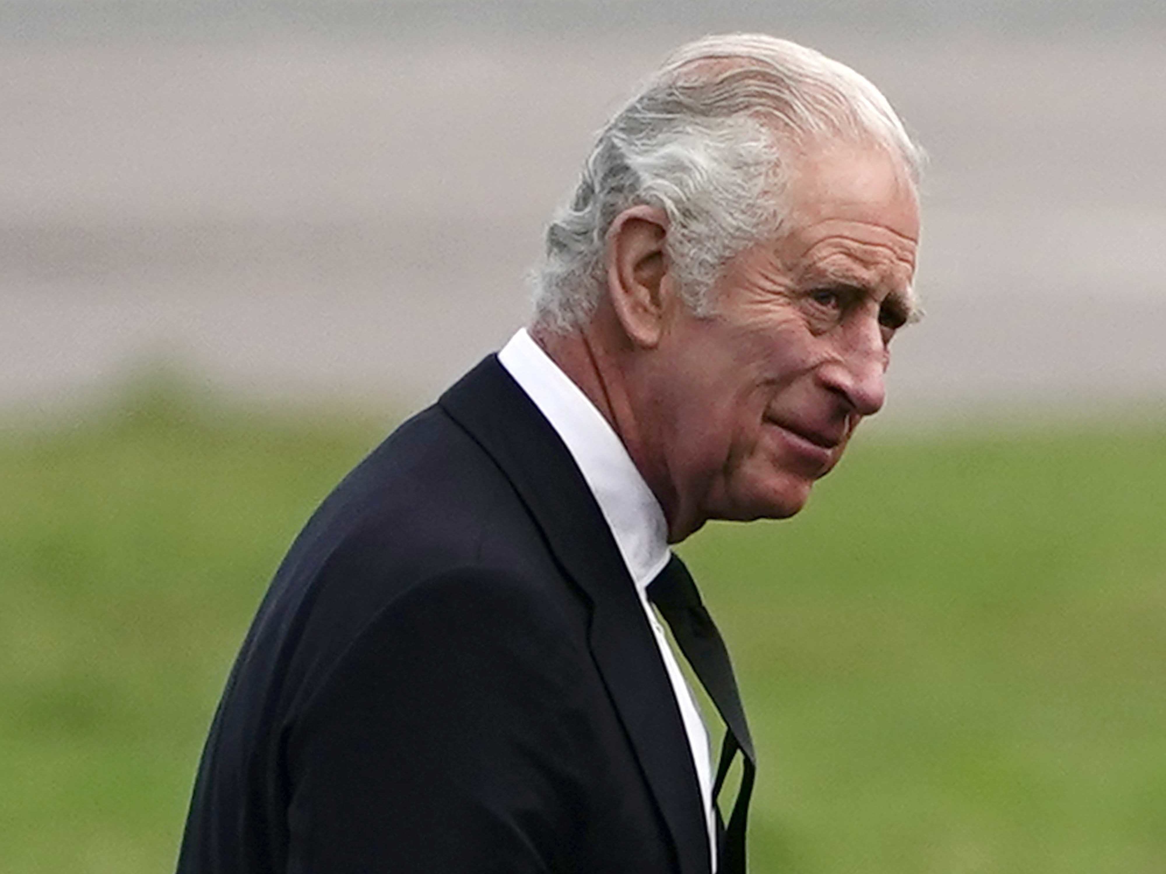 King Charles III shook hands and spoke with three members of staff before climbing on board flight to London