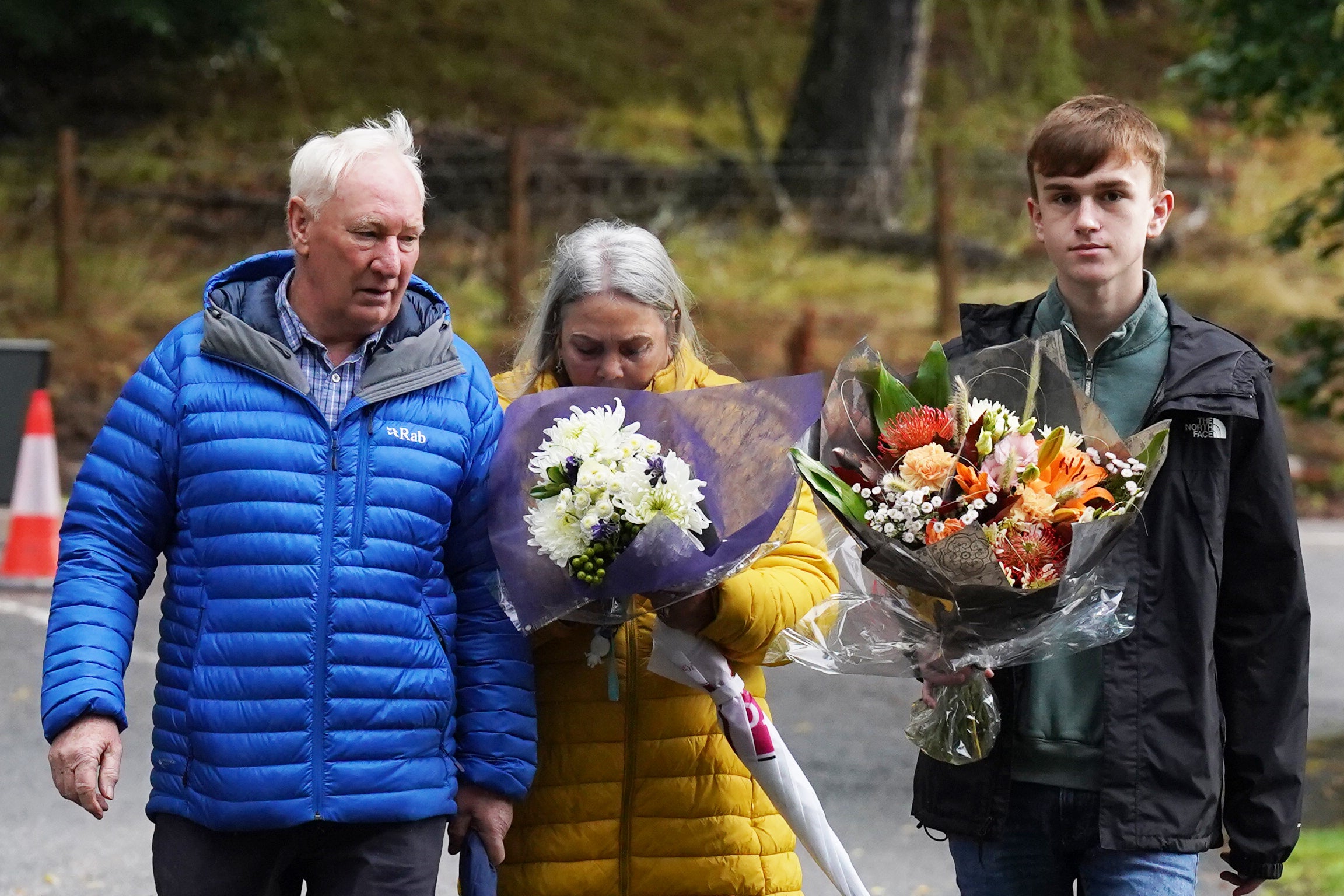 Mourners arrive with flowers at Balmoral, where the Queen died on Thursday afternoon (Owen Humphreys/PA)