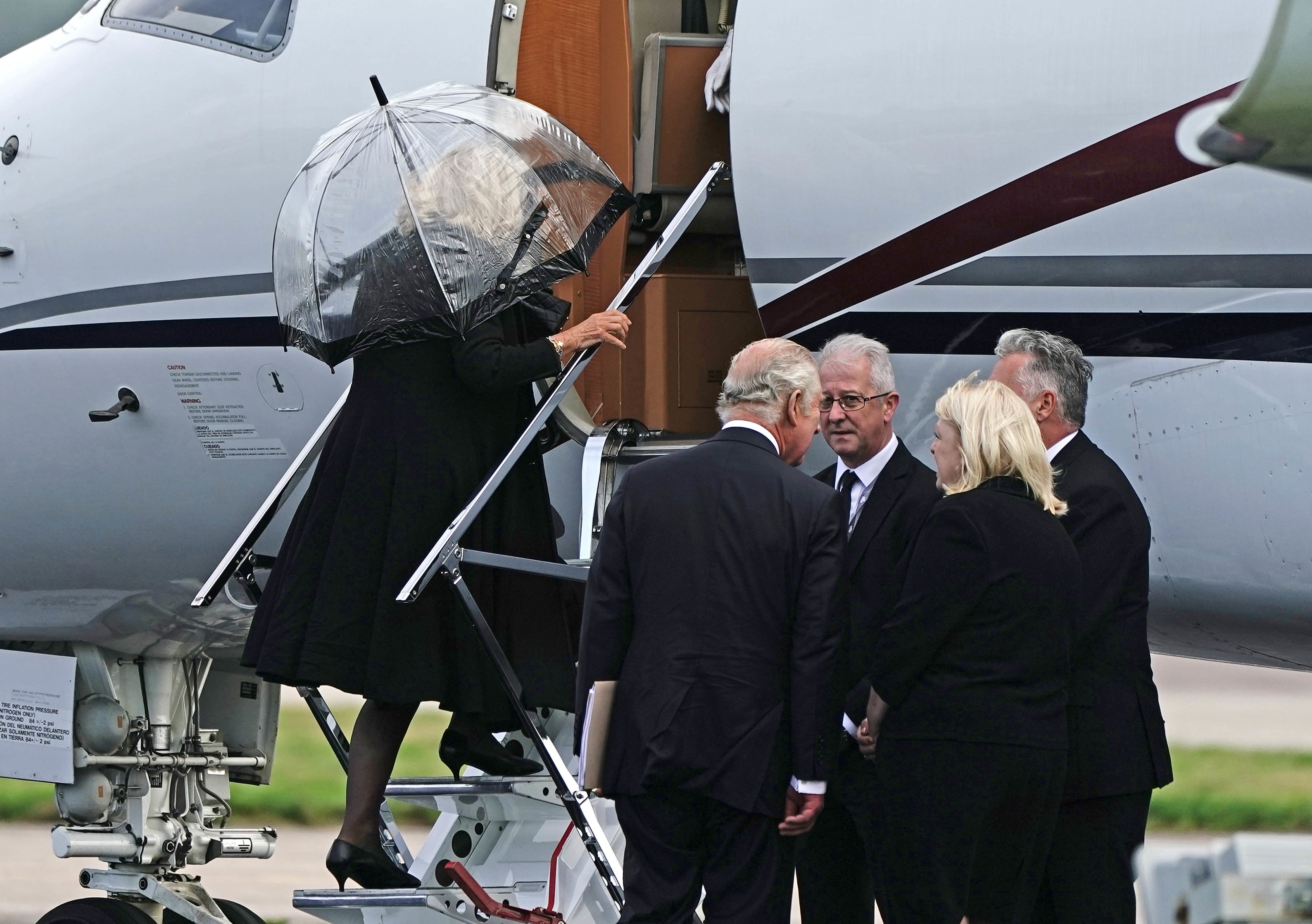 King Charles III and the Queen boarding a plane at Aberdeen Airport (Aaron Chown/PA)