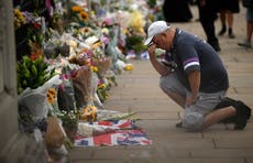 ‘I loved her’: Unapologetically sad, cheerfully rained on – Britain through the eyes of the Queen’s mourners