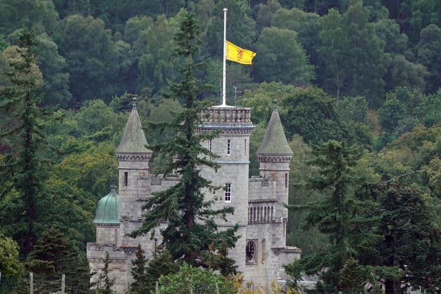 <p>The Royal Banner of Scotland is flown at half mast at Balmoral following the death of Queen (Owen Humphreys/PA)</p>