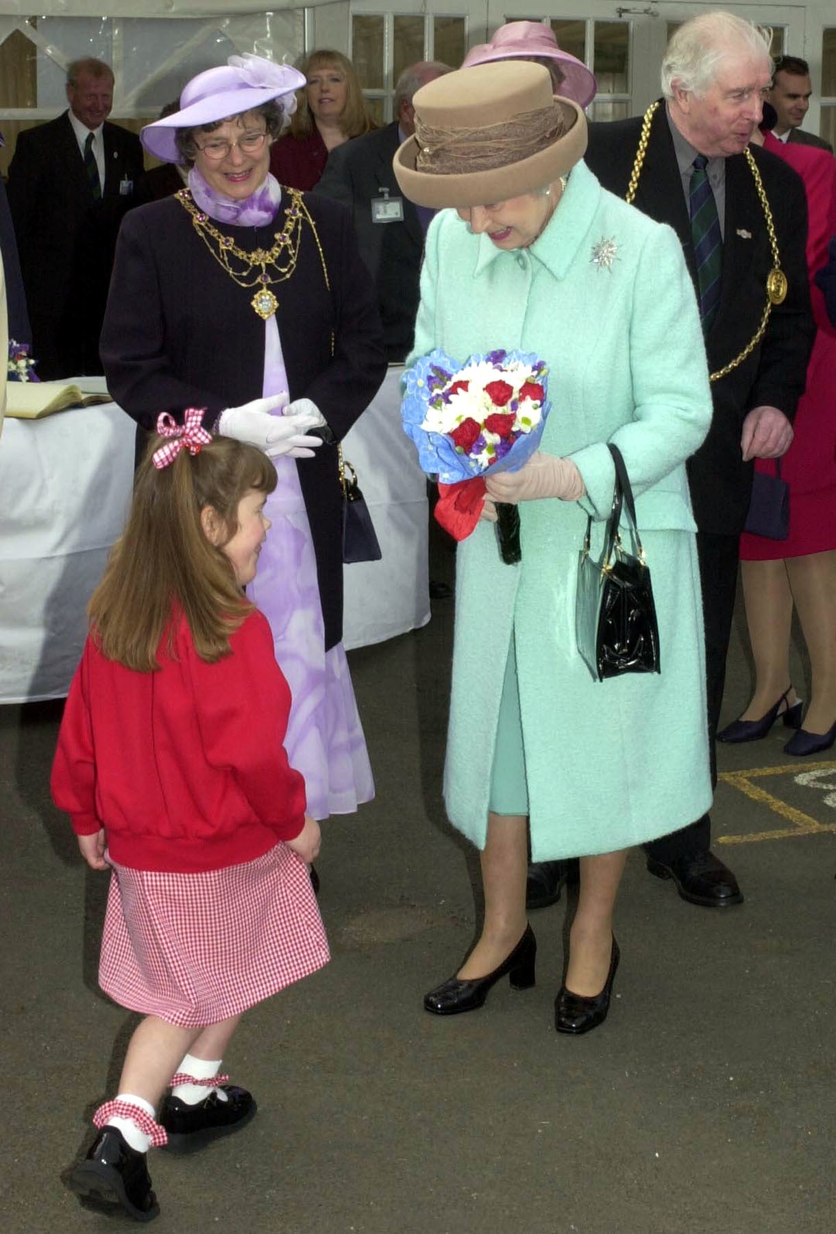 Katie Meehan, photographed with the Queen by PA in 2002, described the moment as ‘hilarious’ (PA)
