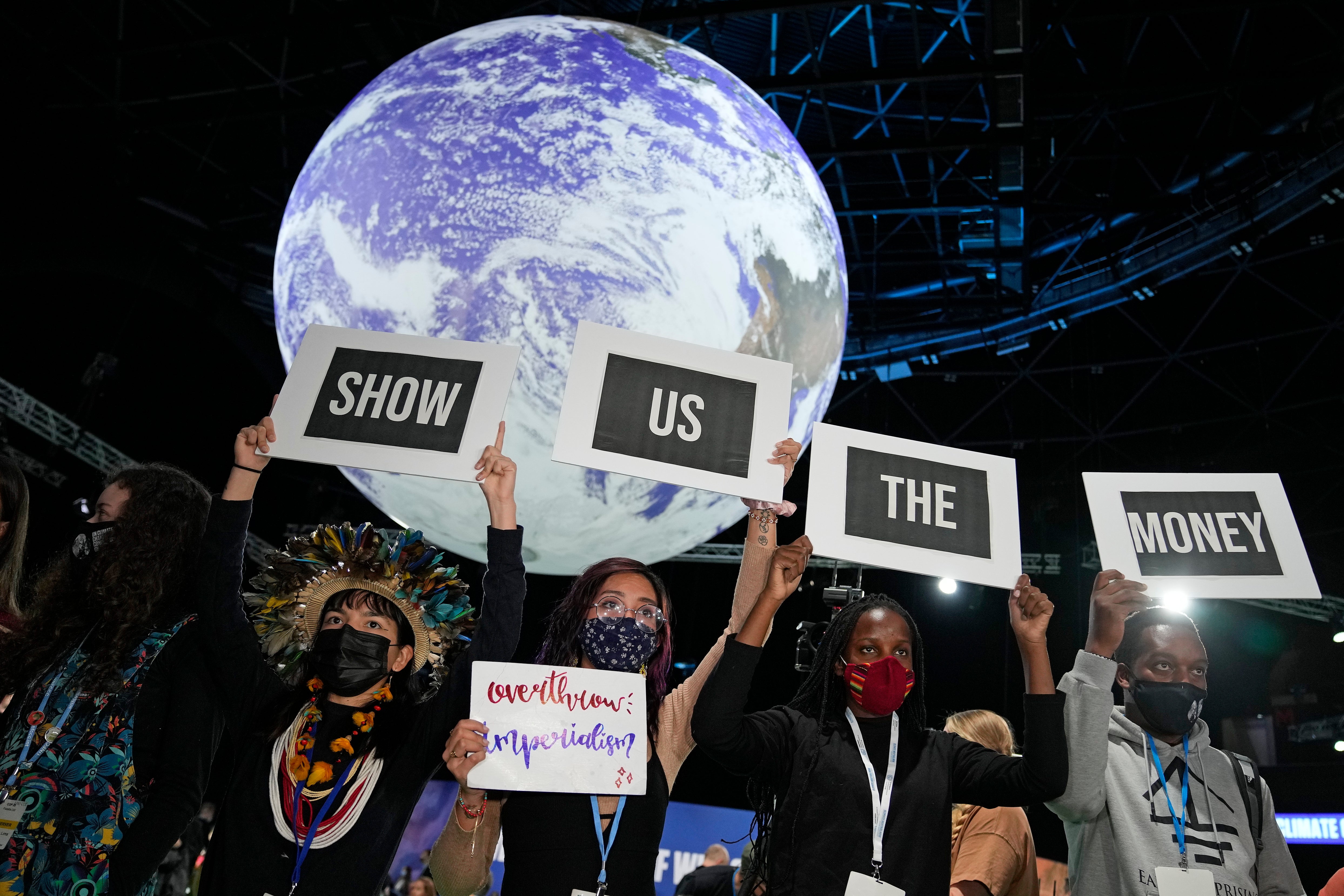 Climate activists engage in a protest at Cop26 in Glasgow, November 2021