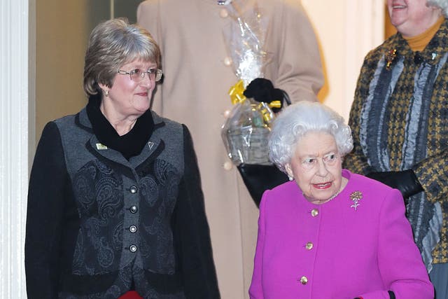 Queen Elizabeth II with Vice President Yvonne Browne (left) as she leaves West Newton village hall in Norfolk after attending a meeting of the Sandringham Women’s Institute (Chris Radburn/PA)