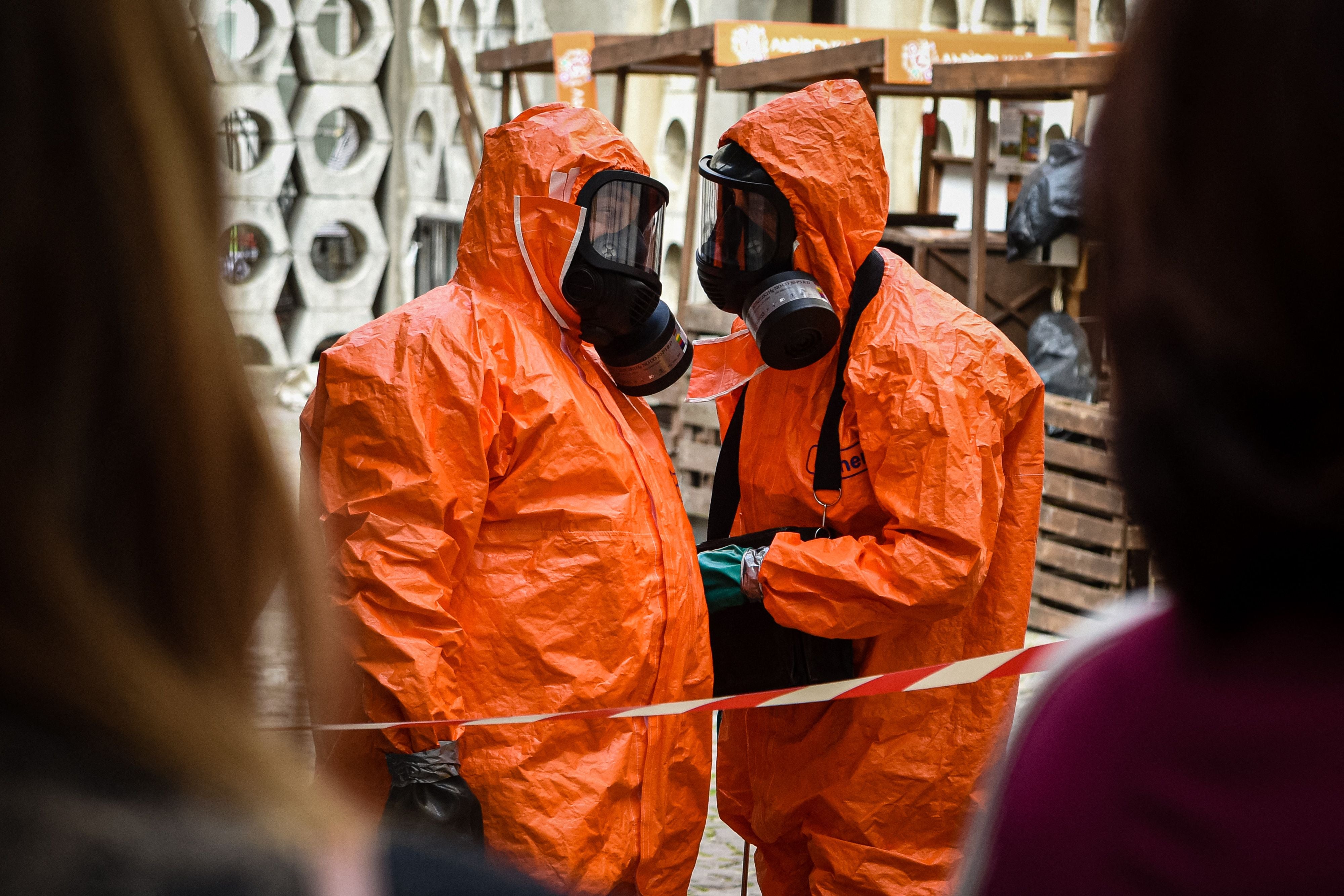Ukrainian Emergency Ministry rescuers wear protective clothing during a nuclear emergency training session for civilians