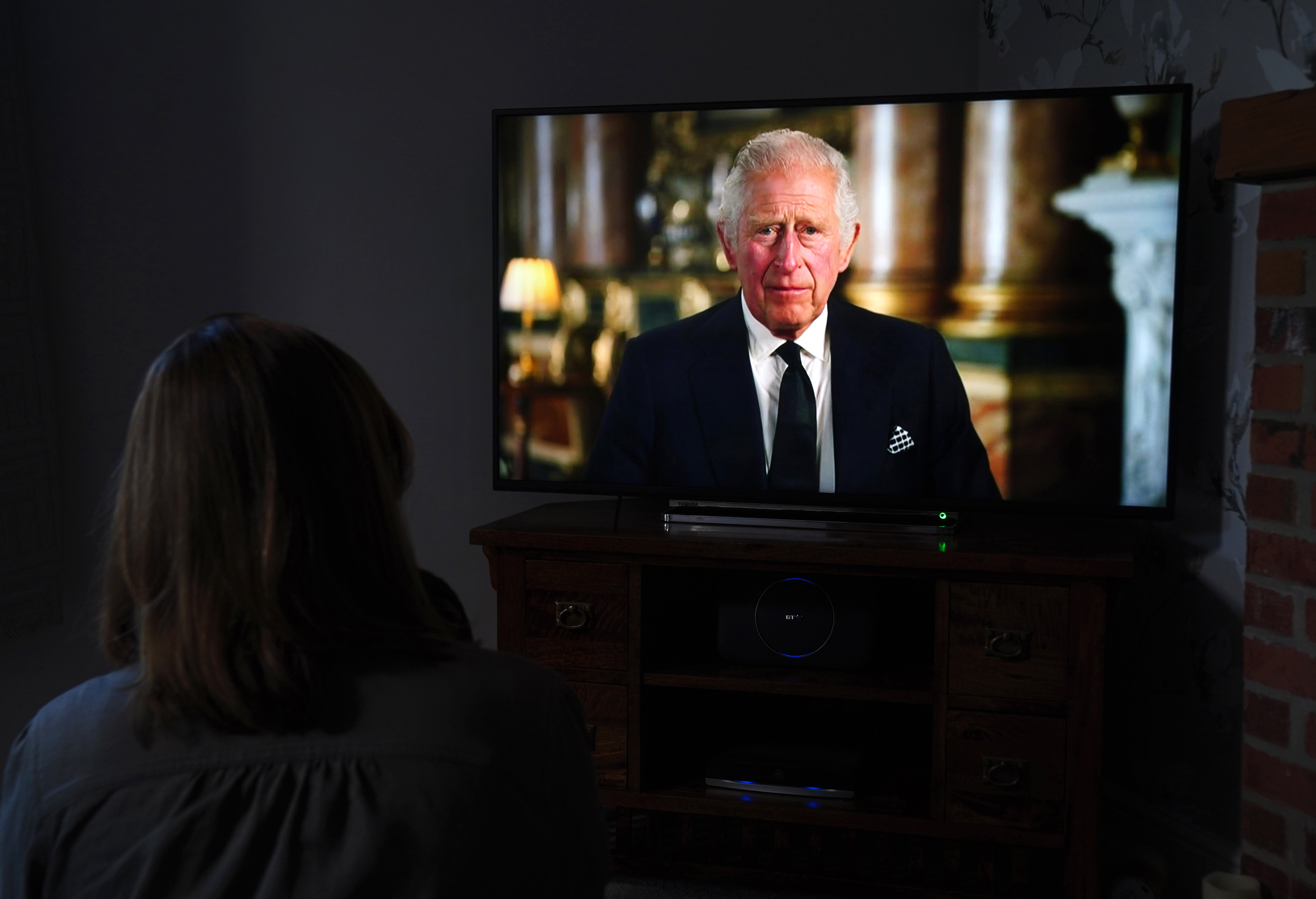 A child watching a broadcast of King Charles III’s first address to the nation (Mike Egerton/PA)