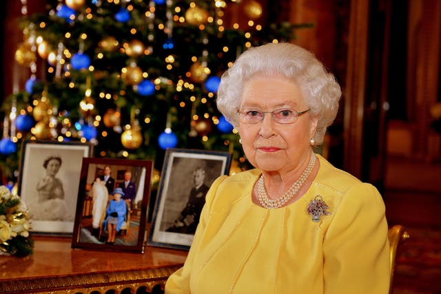 <p>The Queen after recording her Christmas Day broadcast in the Blue Drawing Room at Buckingham Palace in 2013 (John Stillwell/PA)</p>