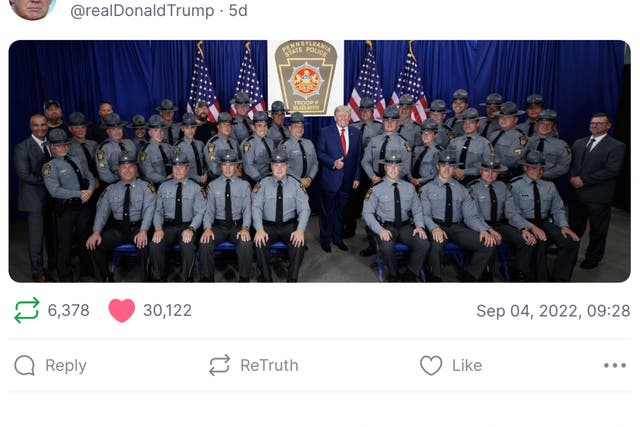 <p>Donald Trump’s Truth Social account posted a picture of him with Pennsylvania state troopers</p>