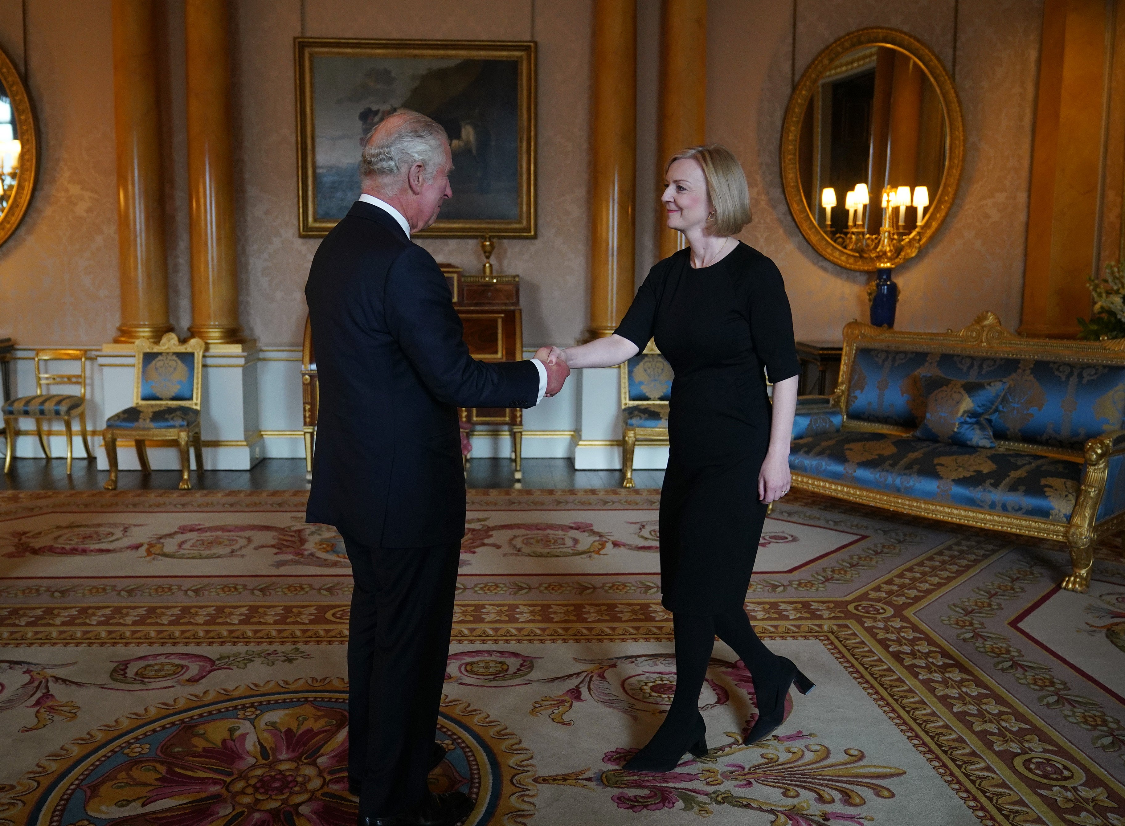 Charles shakes hands with Liz Truss during their first audience at Buckingham Palace (Yui Mok/PA)